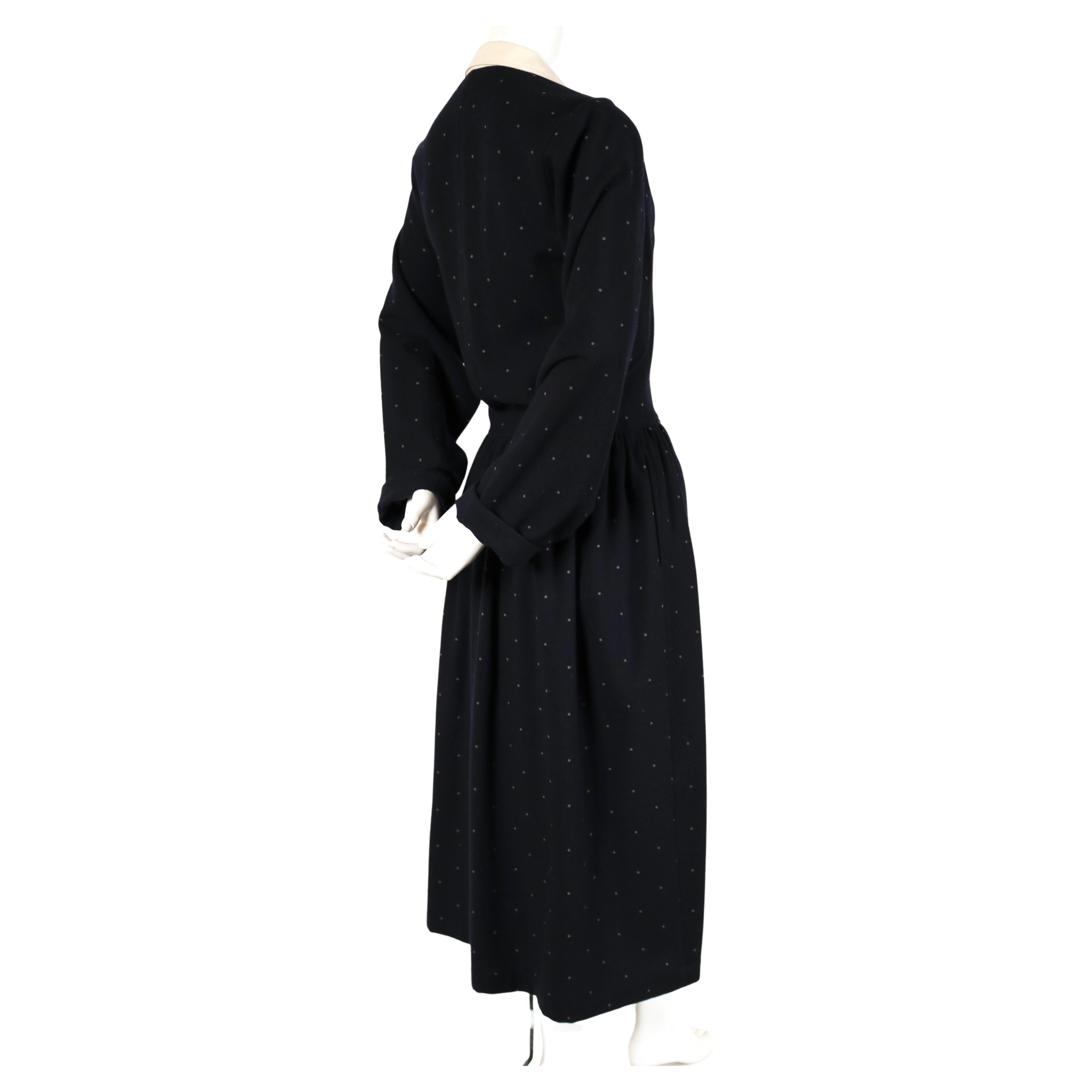 Very rare, navy-blue and off white polka dot woven wool dress with asymmetrical closure and draped front from Comme Des Garcons dating to 1985. Japanese size 'S'. Approximate measurements: shoulders 14.5
