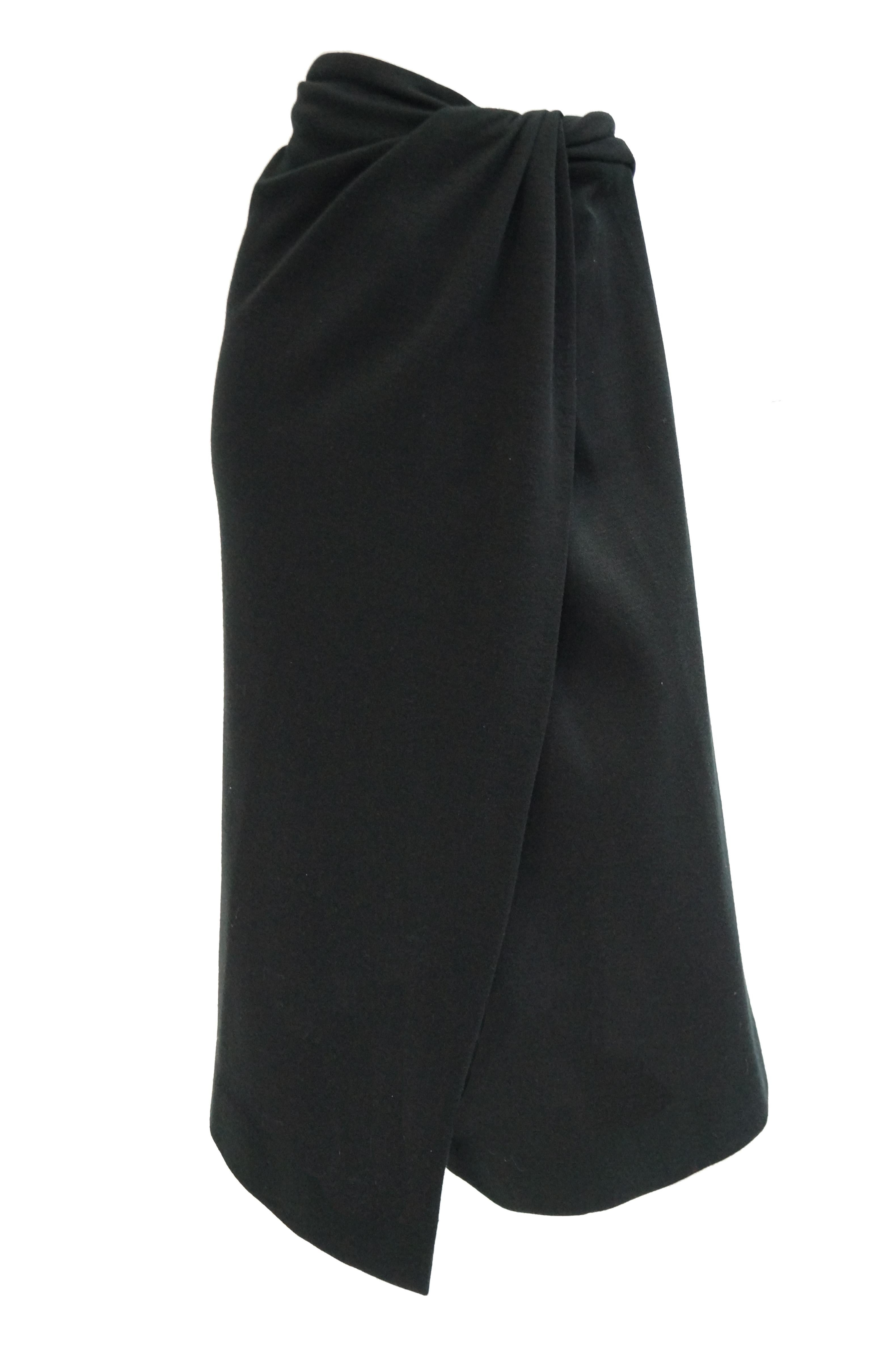 “THE wrap skirt” was designed in black lightweight wool goes with absolutely everything! 

In 1985, after having worked at Anne Klein for over a decade (Klein so trusted her judgement that she brought Karan with her to the famous 