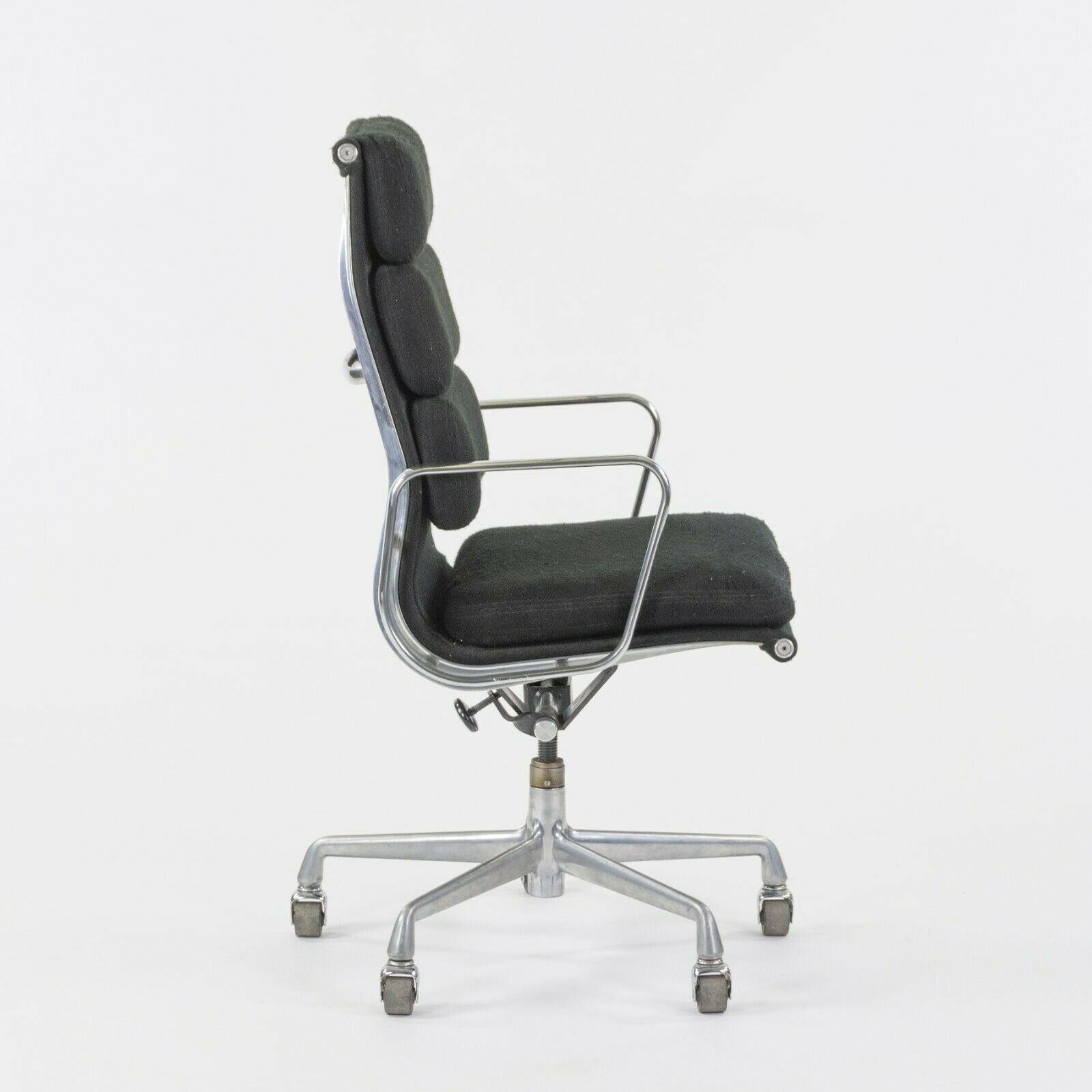 Listed for sale is a vintage Herman Miller Eames Aluminum Group executive soft pad desk chair. This is a rare example, which was produced in the 1980s and was specially ordered in a black fabric upholstery. Many of these examples were produced in