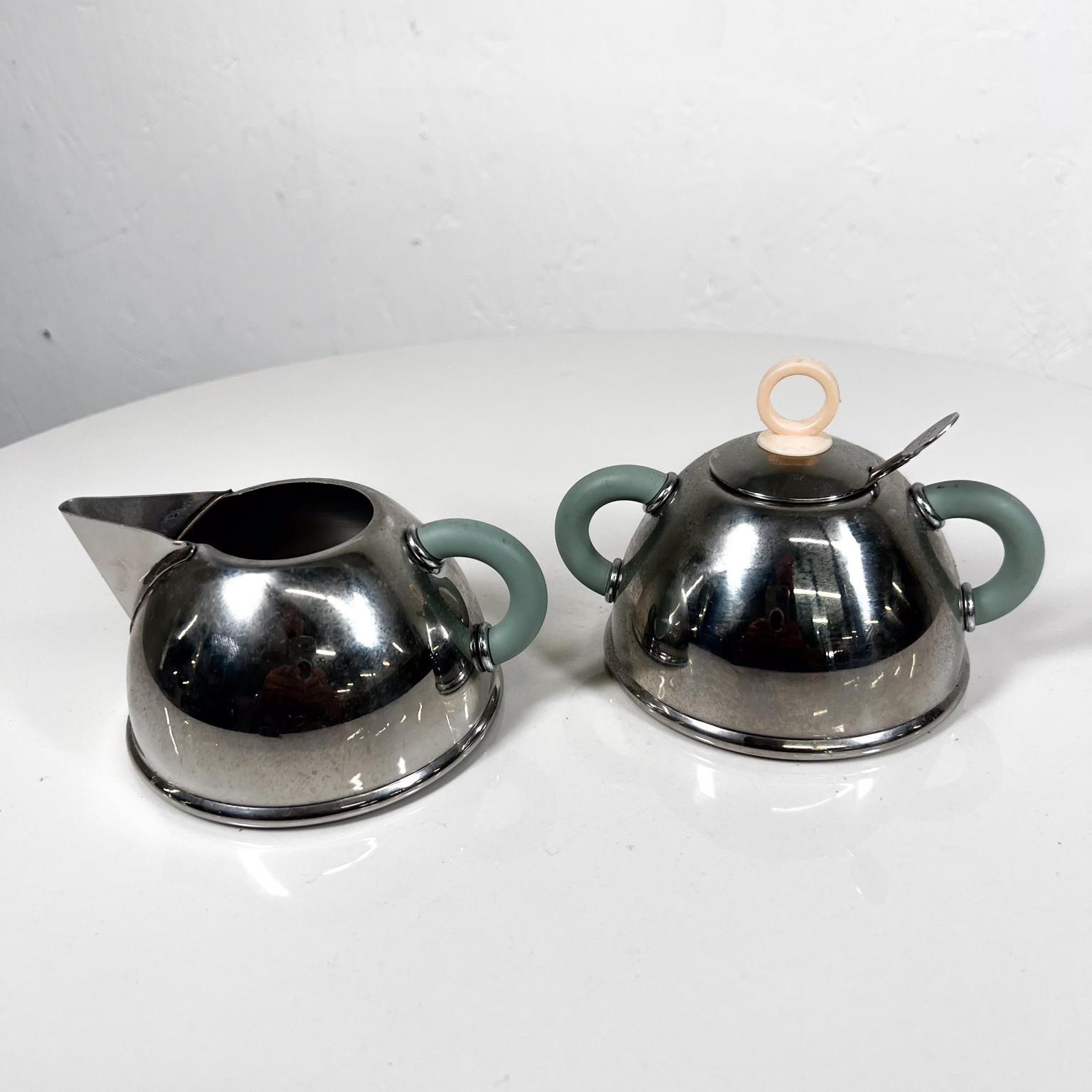 1985 Iconic Alessi sugar bowl and creamer designed by Michael Graves.
Made Taiwan
Stainless Steel
Creamer 5 x 4 w x 2.5 h
Sugar 5 x 4 x 3.63 h
Original sugar spoon is included. 
Preowned original vintage condition
Refer to images please.