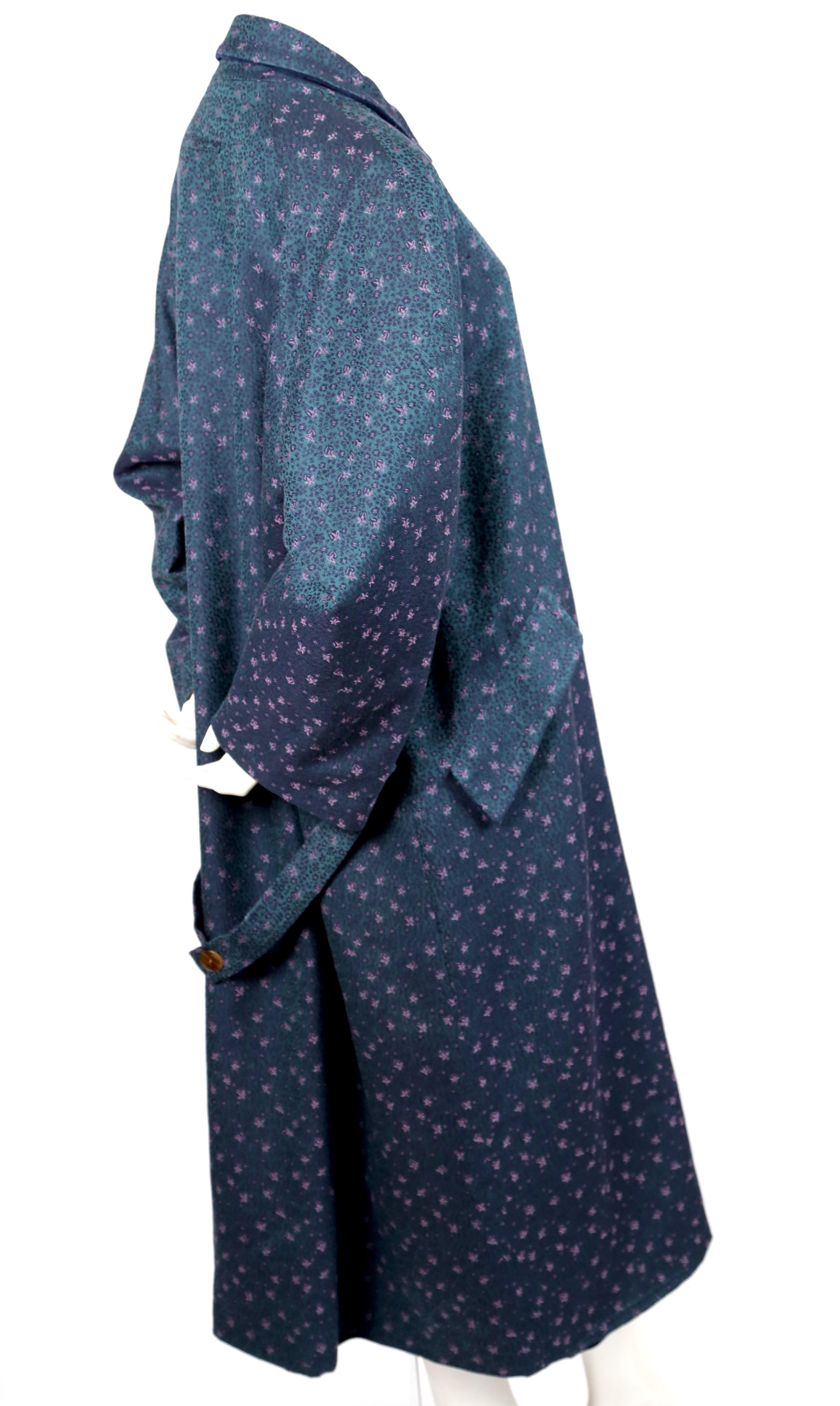Oversized, blue, green and purple floral jacquard wool overcoat designed by Jean Paul Gaultier for Gibo dating to fall of 1985 as seen on the runway. No size is indicated however this fits many sizes due to the oversized cut. Coat was photographed