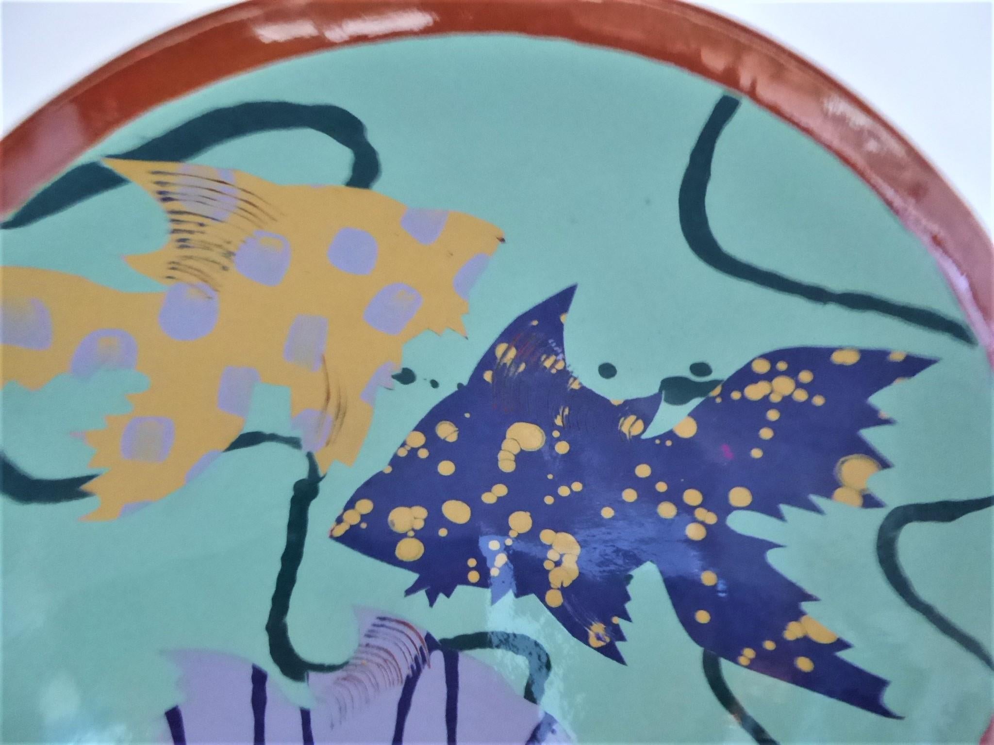 Beautiful modern large pottery bowl from 1980s hand painted underglaze with 3 colorful Angel (?) fish. Signed, perhaps reading Linda Carlson, on bottom and dated 1985. Tropical and Miami Vice area accent for any room's decor. A great centerpiece. In