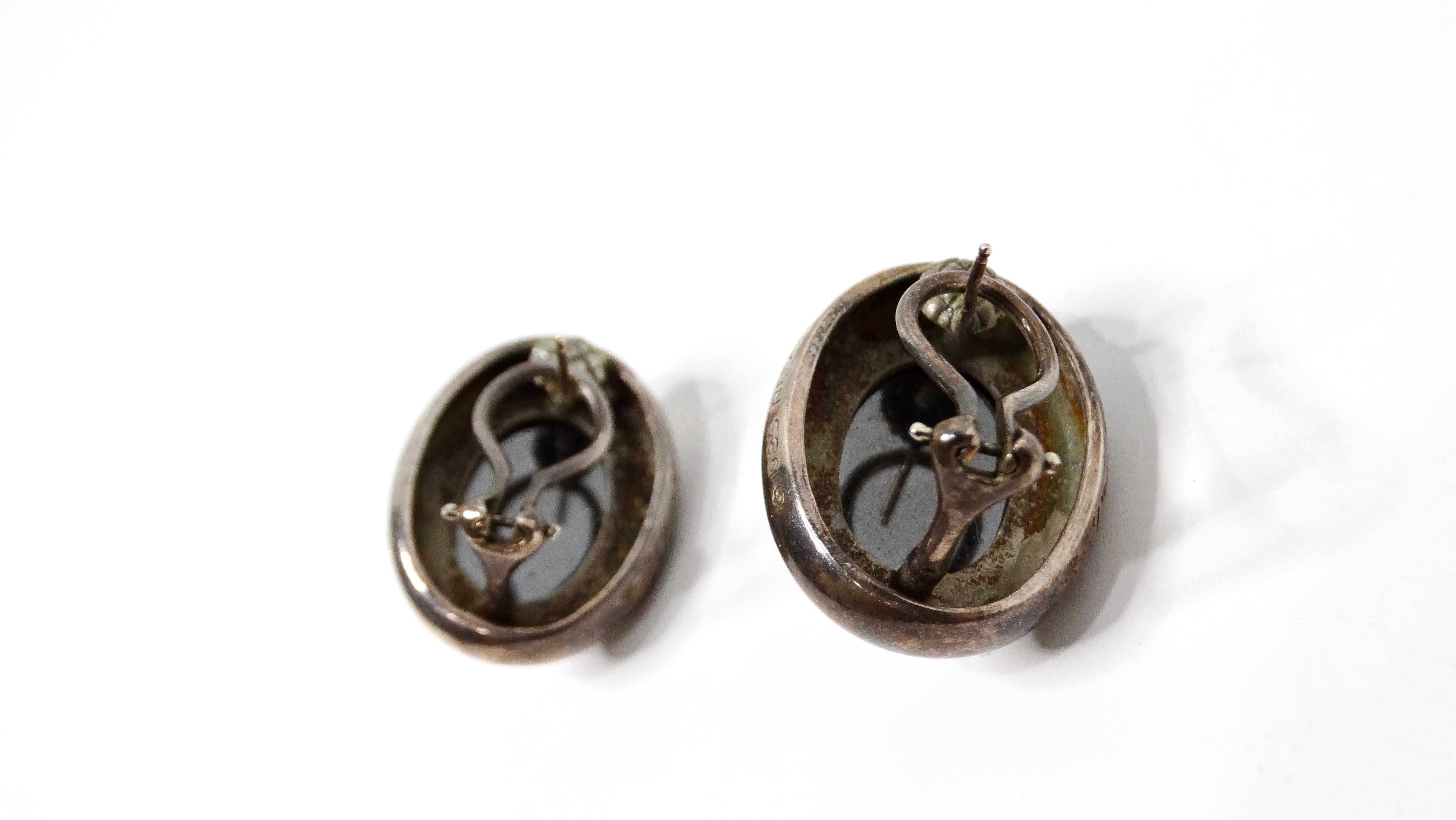 Paloma Picasso, renowned for her vibrant creativity and artistic vision, designed these exquisite Hematite Sterling Silver Oval Earrings for Tiffany & Co. The earrings feature a stunning hematite gemstone set in the center of an elegant oval