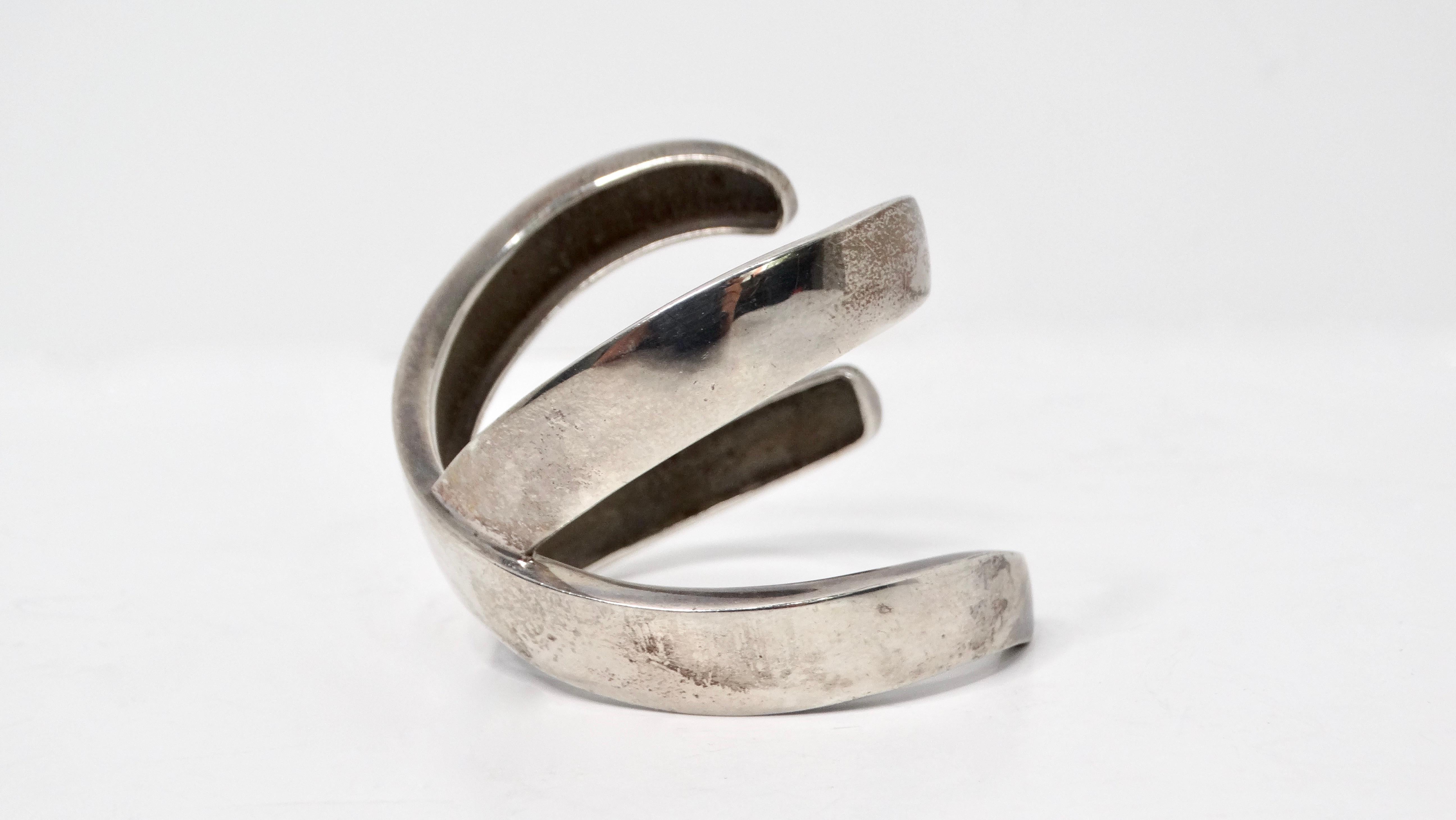 The 1985 Paloma Picasso for Tiffany & Co. Sterling Silver Graffiti X Cuff Bracelet is a stunning piece that seamlessly combines artistic innovation and luxury craftsmanship. Known for its bold, intricate designs, Paloma Picasso's creations often