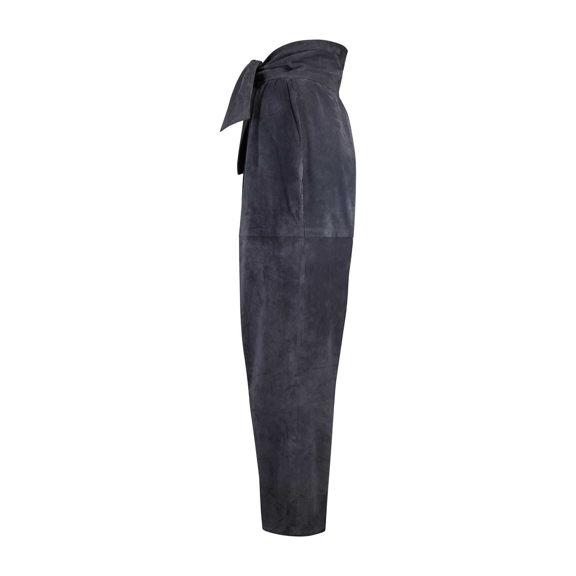 These rare suede trousers were designed by Yves Saint Laurent for his Fall 1985 collection and walked the runway across four looks in different colour ways including black, grey and purple. Made in France, they are crafted from buttery suede in a