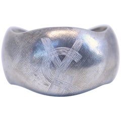 1985 YVES SAINT LAURENT silver toned logo cuff