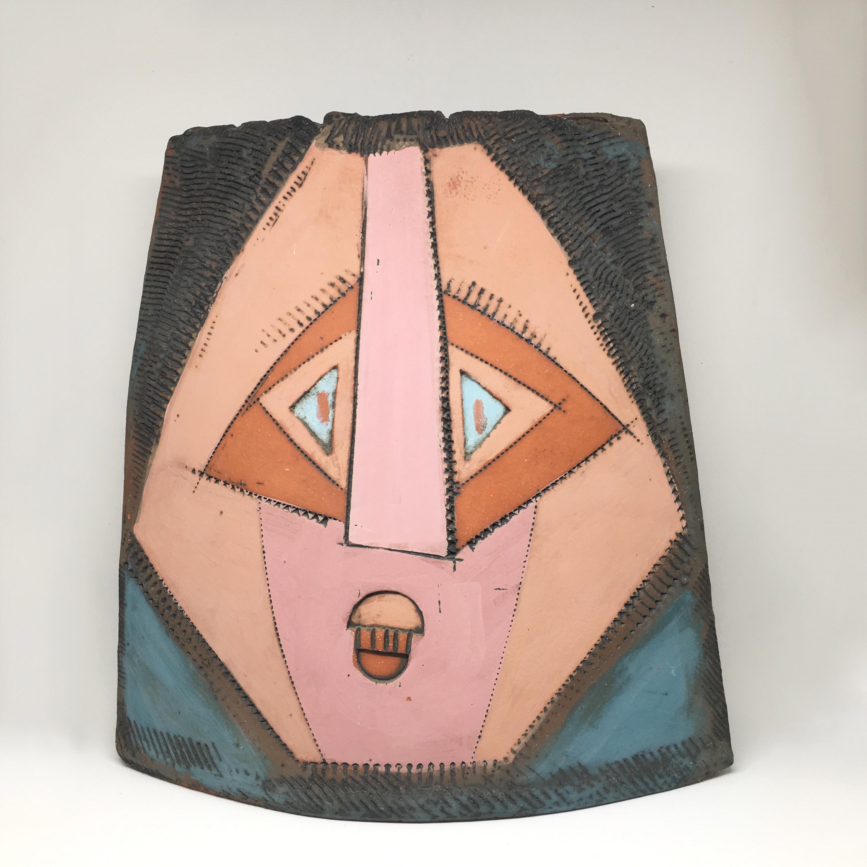 1986 Artist signed cubist faces studio pottery vase with surreal faces on both sides. One side portrays two faces (perhaps in a lovers embrace) and a third single face on the opposite side. Stunning colors throughout this immaculate piece.