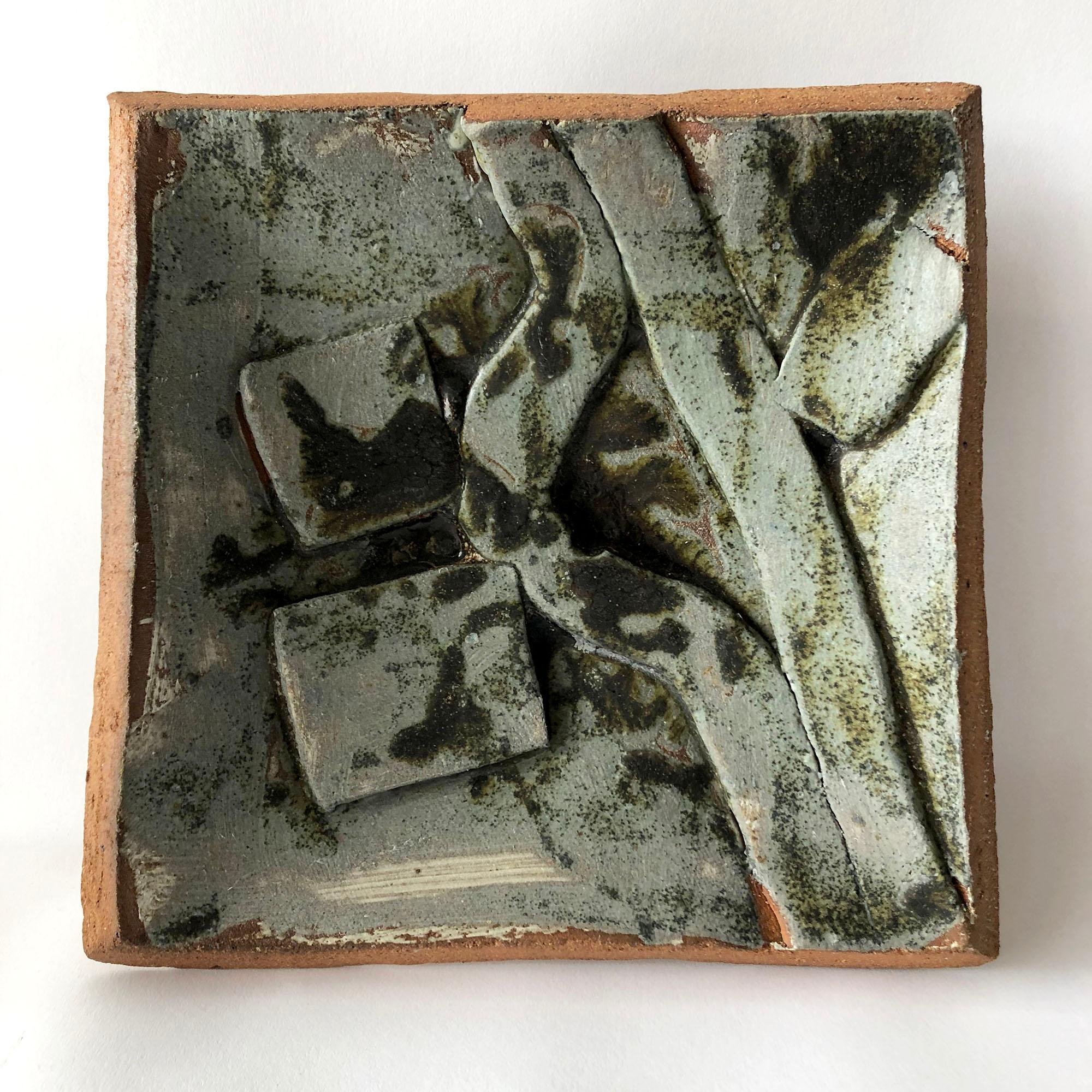 Slab built stoneware tryptic with abstract design created in 1986. Pieces have measurements between 9.75