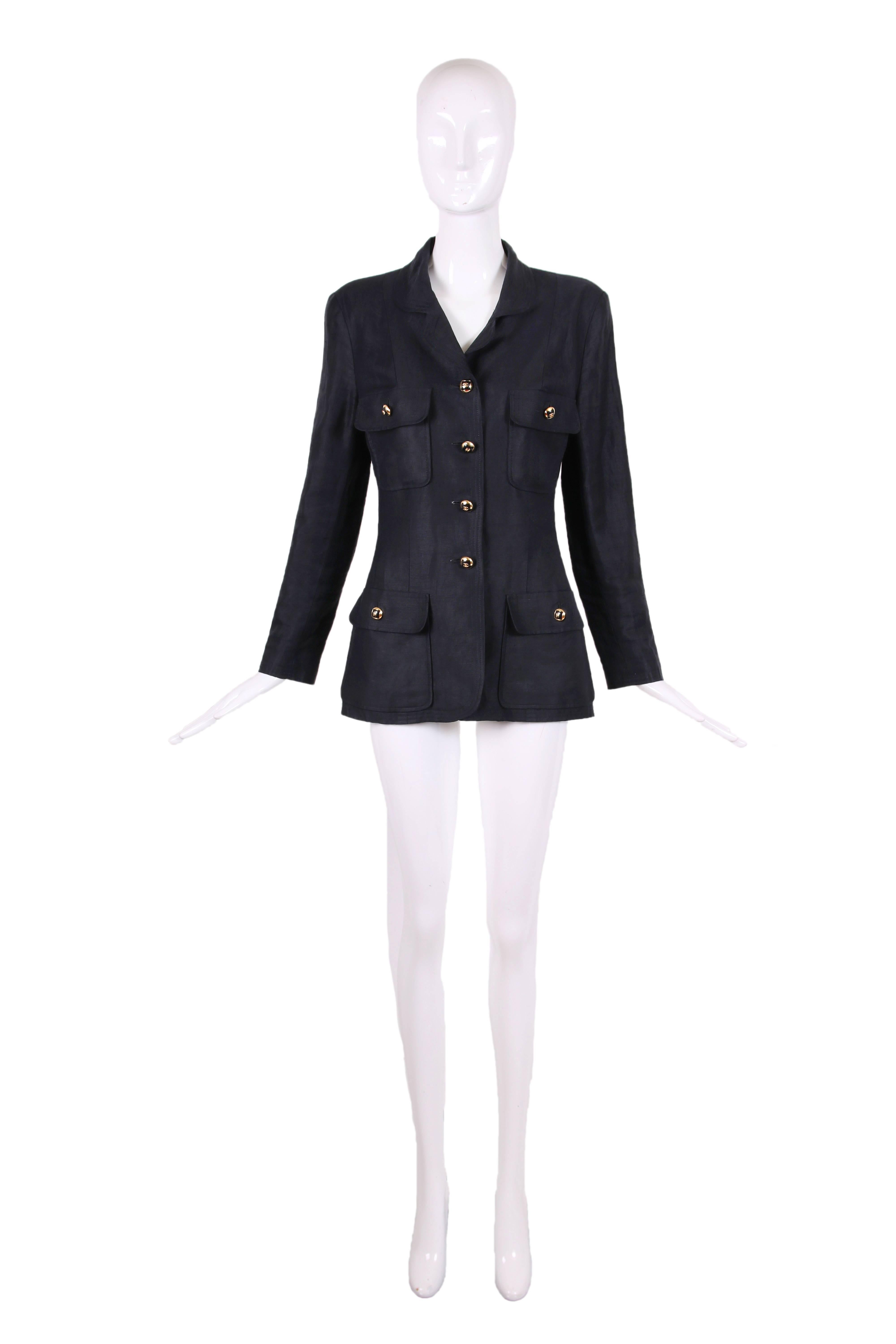 1986 Chanel black linen jacket w/four frontal flap pockets and 14 gold tone domed CC logo buttons w/black square insert in the center - 3 at each cuff, down center front and at the four pockets. No size tag so please consult measurements. Jacket is