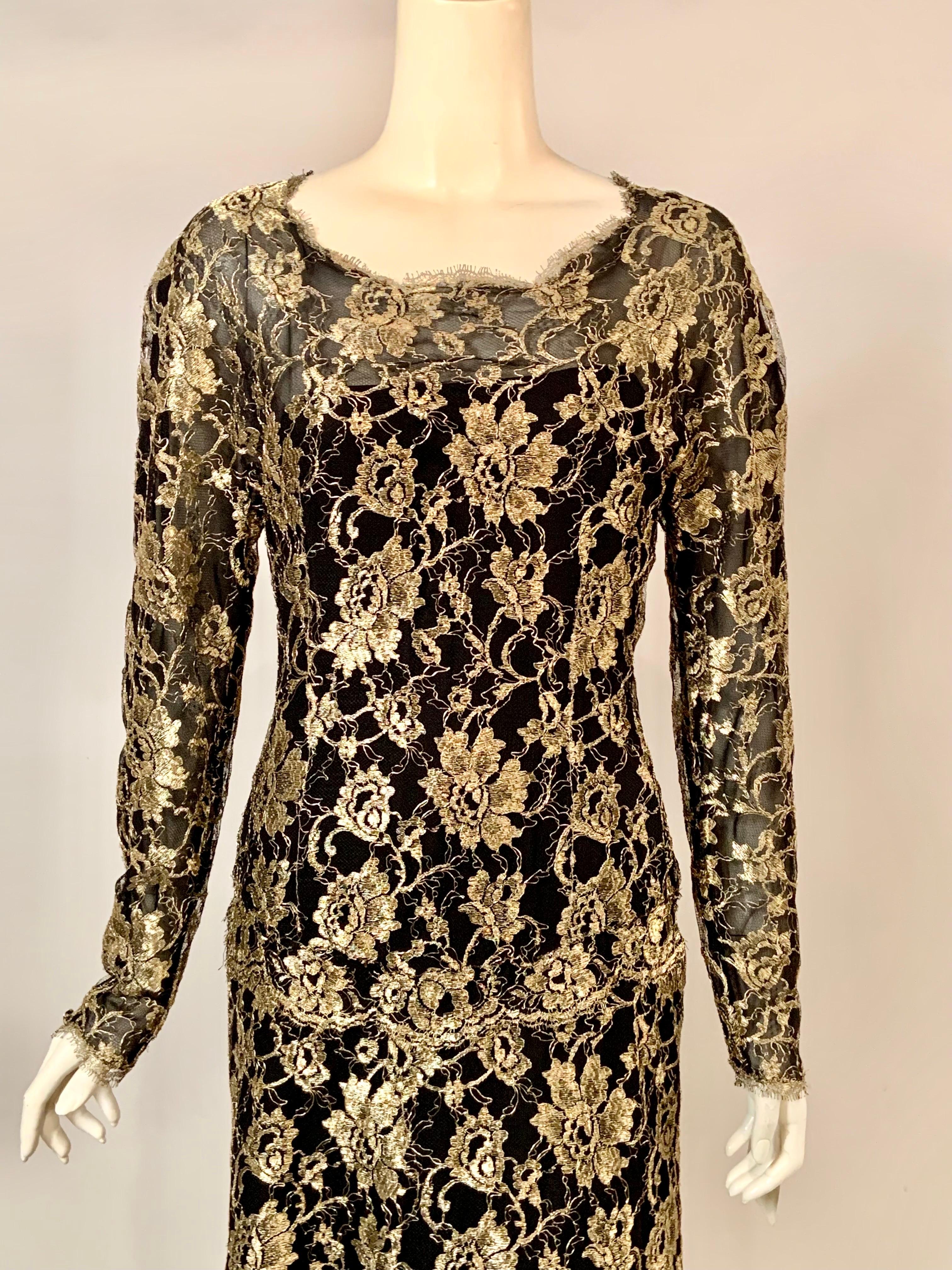 Karl Lagerfeld designed this glamorous Chanel gold and black lace evening gown with a train in 1986.  The dress has a round neckline, a dropped waistline, long sleeves, and covered buttons and loops at the center back above the trained skirt.  The