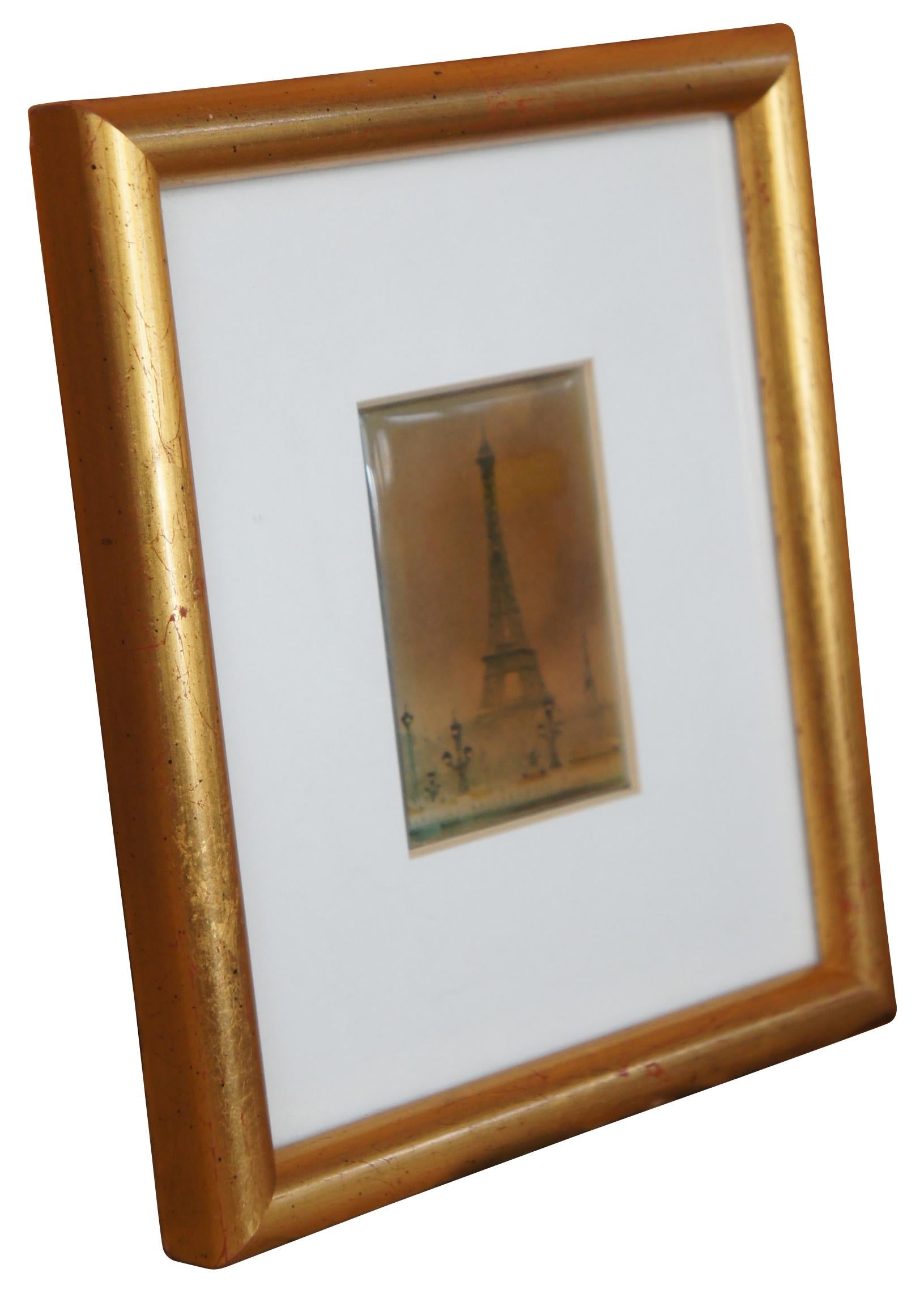 Vintage hand painted ceramic tile in a white matted gold frame. The tile features a scene of the Eiffel Tower viewed from a Paris street.

Measures: 5.5