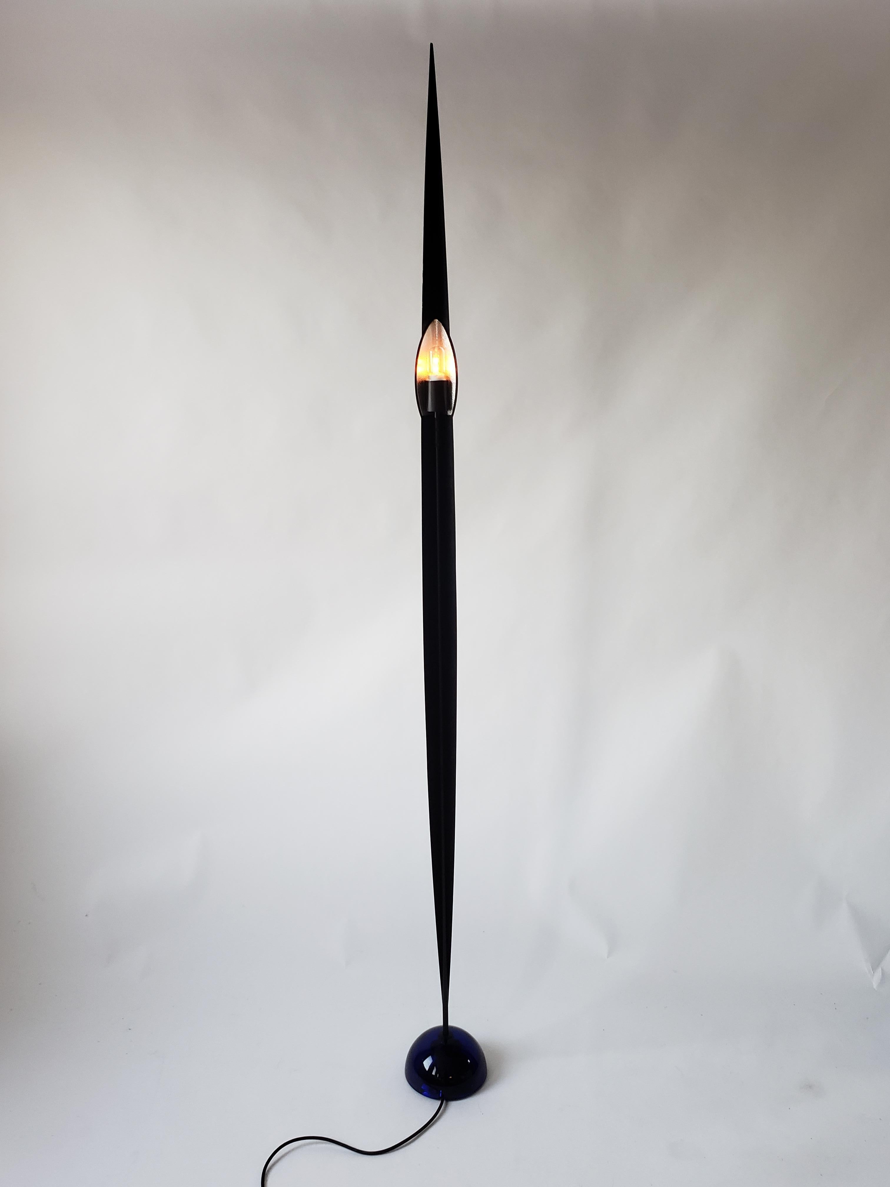 Minimalist , elegant , sculptural halogen floor lamp by Gilles Derain . 

Epoxy powder coated finish . 

Extremely thick and heavy Murano glass cobalt blue base .

81 inches high .

E26 thick ceramic socket rated at 250 watts . 

 After