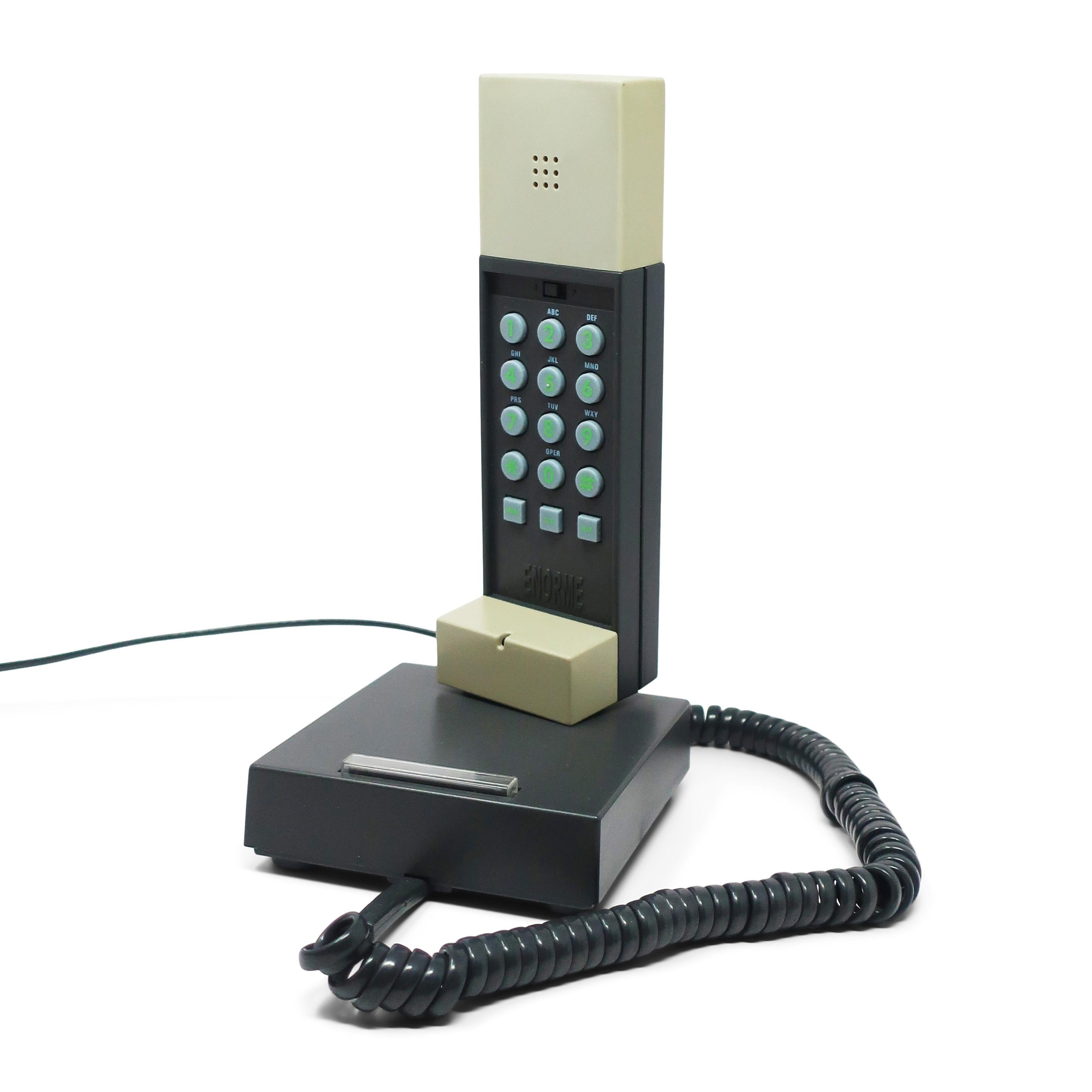 A perfectly postmodern telephone designed by the Memphis Milano master, Ettore Sottsass, and produced in 1986.  The Enorme phone was produced in another color way but this is the much rarer gray and black version.  The Enorme telephone was the