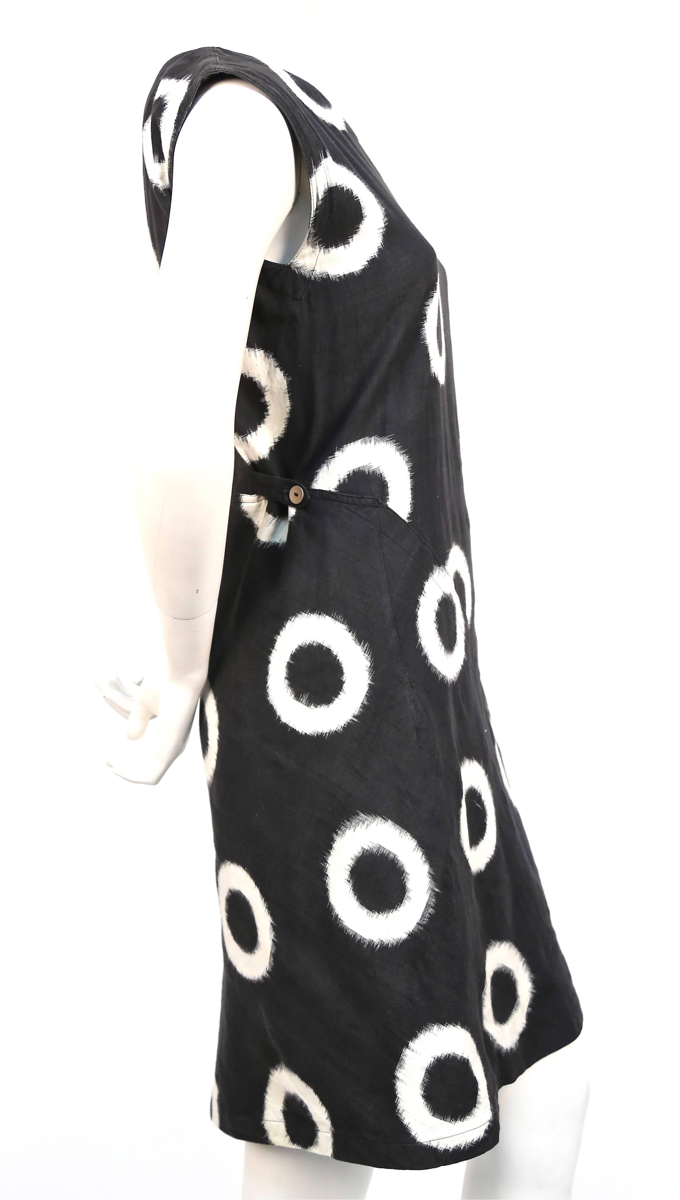 Soft black and off-white circular Ikat printed cotton dress from Issey Miyake dating to 1986.   A very similar dress was featured on the spring 1986 Miyake runway. Dress best fits a size S or possibly a size M. Approximate measurements are: bust