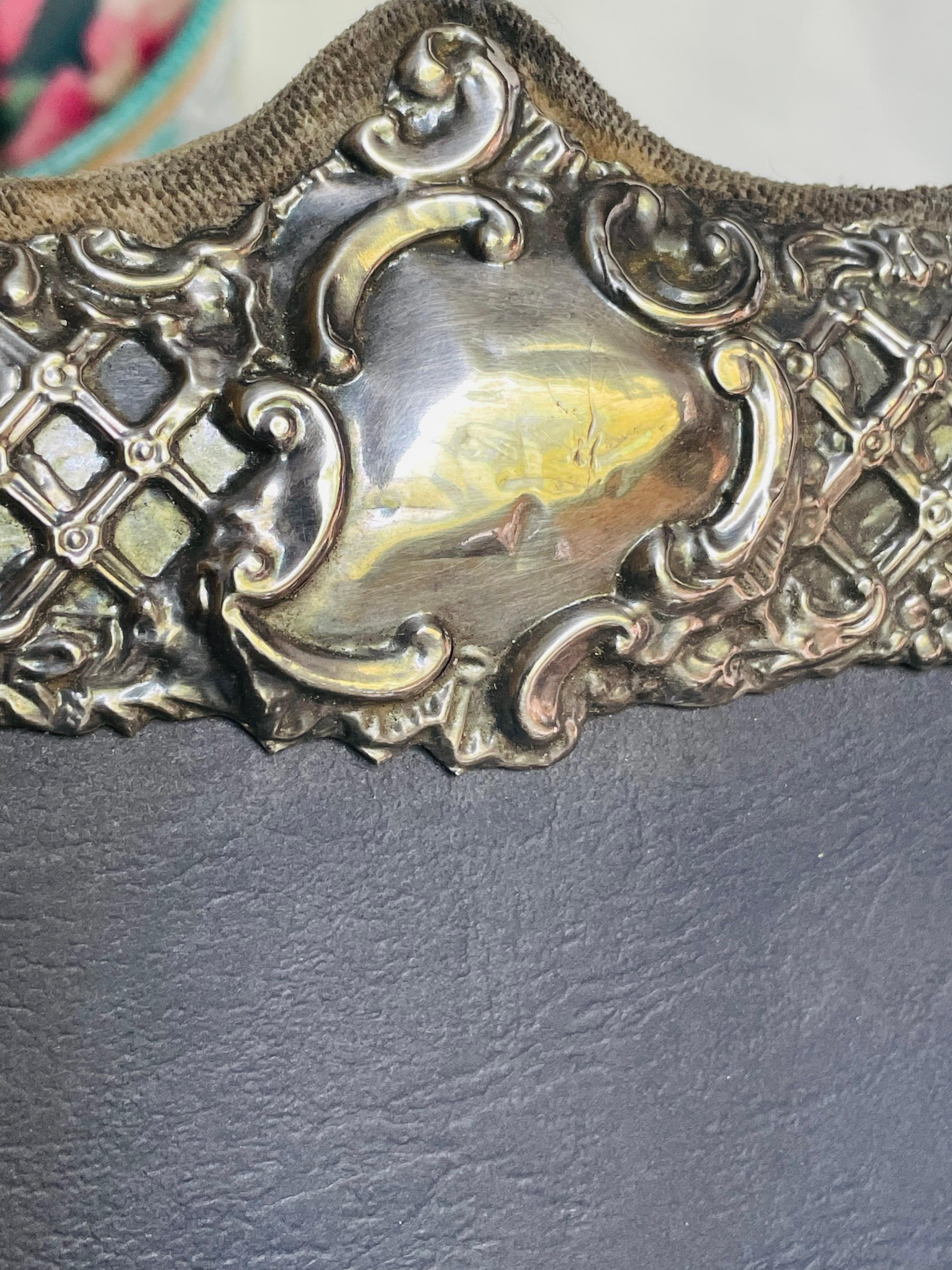 Here is a gorgeous sterling silver impressed lattice, floral and leaf design with a shield on the top that looks like it was meant to be engraved but never was. The smooth shield shape does have some dents and creases. Otherwise, the frame is in