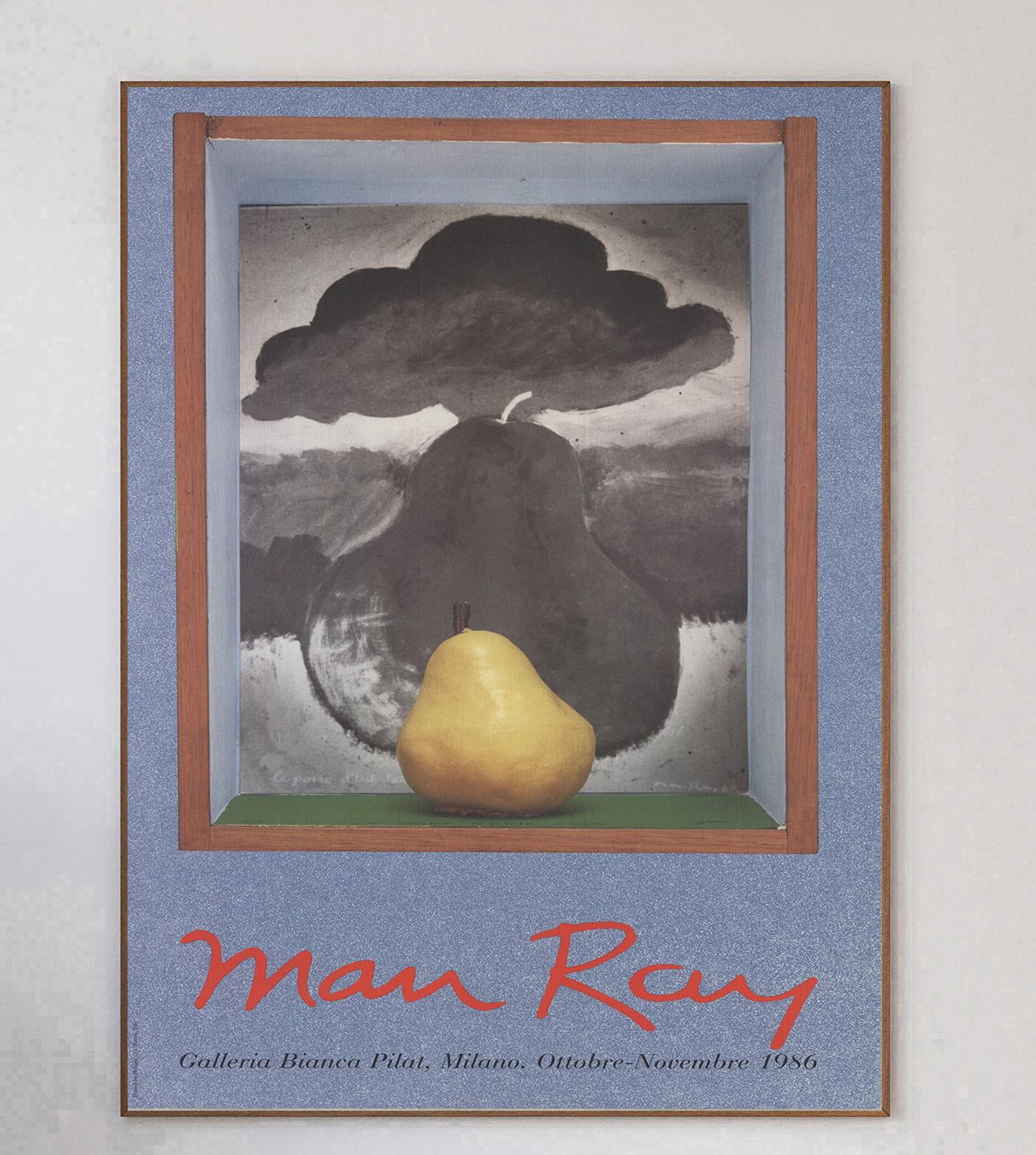 Gorgeous poster promoting Man Ray's solo exhibition at the Galleria Bianca Pilat in Milan, Italy. The exhibition opened on October and ran until November 1986 and featured many of the artists paintings and other media. This piece features his