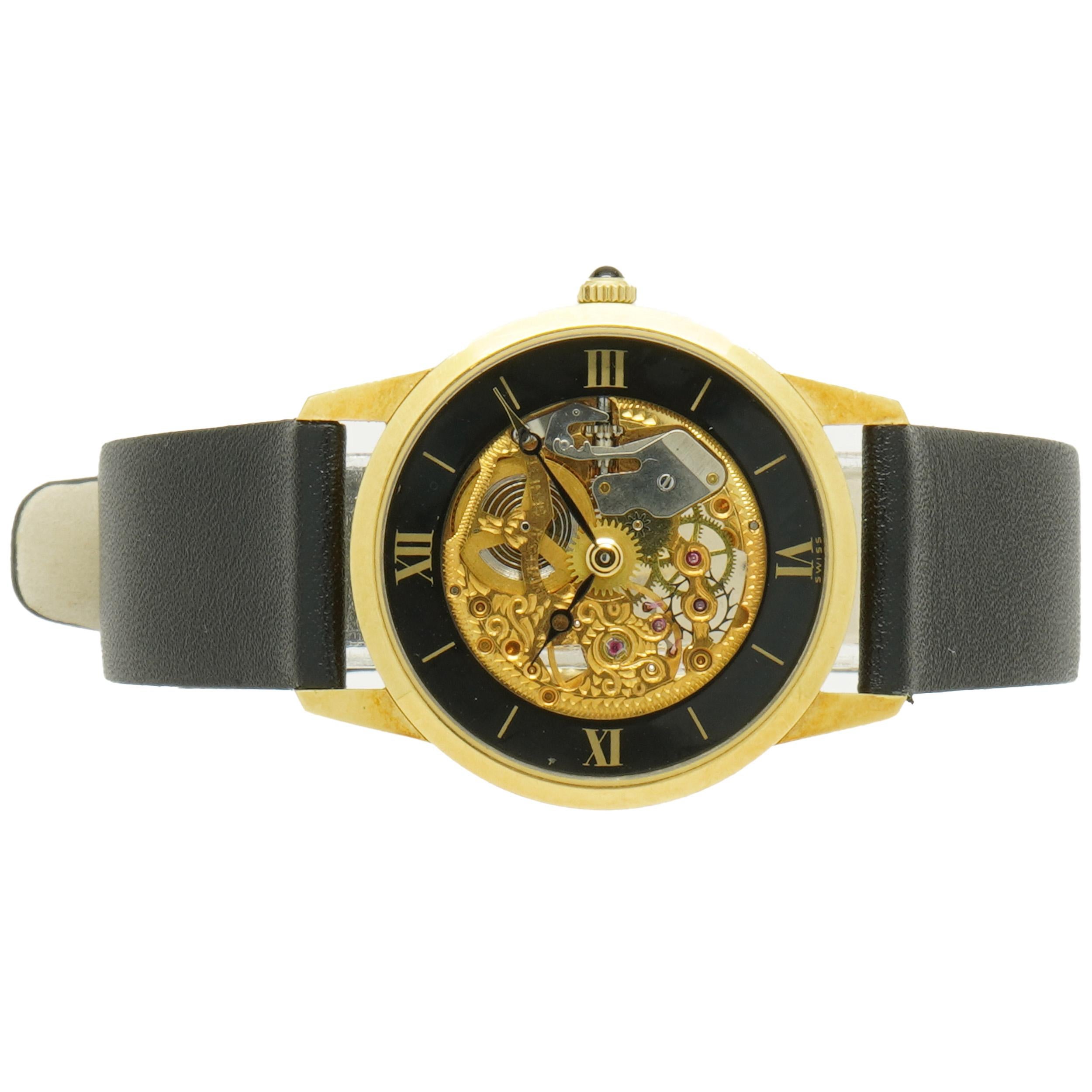 Movement: manual wind
Function: hours, minutes
Case: 30mm 18k yellow gold 
Band: black leather band
Dial: black roman numeral and skeleton dial 
Ref: 1810522

Does not comes with box and papers
Guaranteed authentic by seller