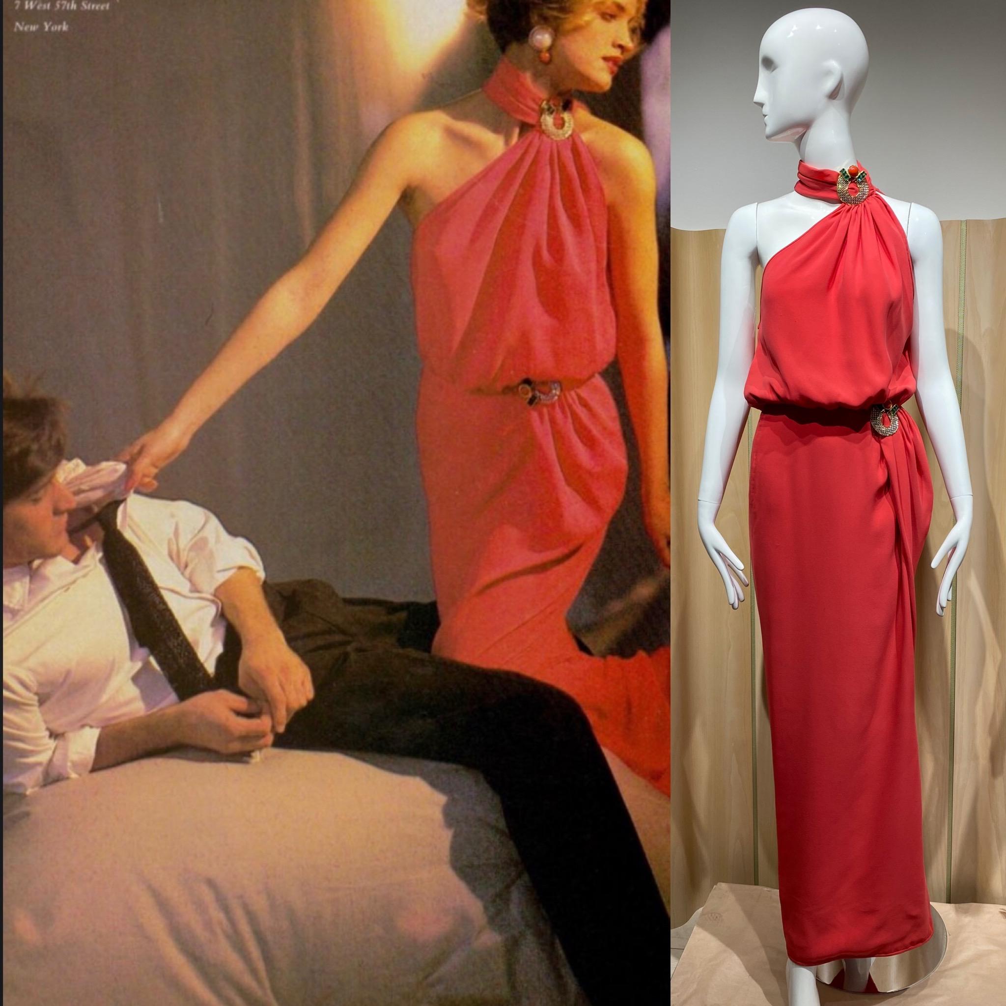 Documented 1986 Valentino Red Salmon Silk Crepe Dress with brooch on the collar and waist.
Beautiful draping and fit.  ( see advertising photo)
Perfect for Black tie event.
Bust: 34”
Waist: 26”