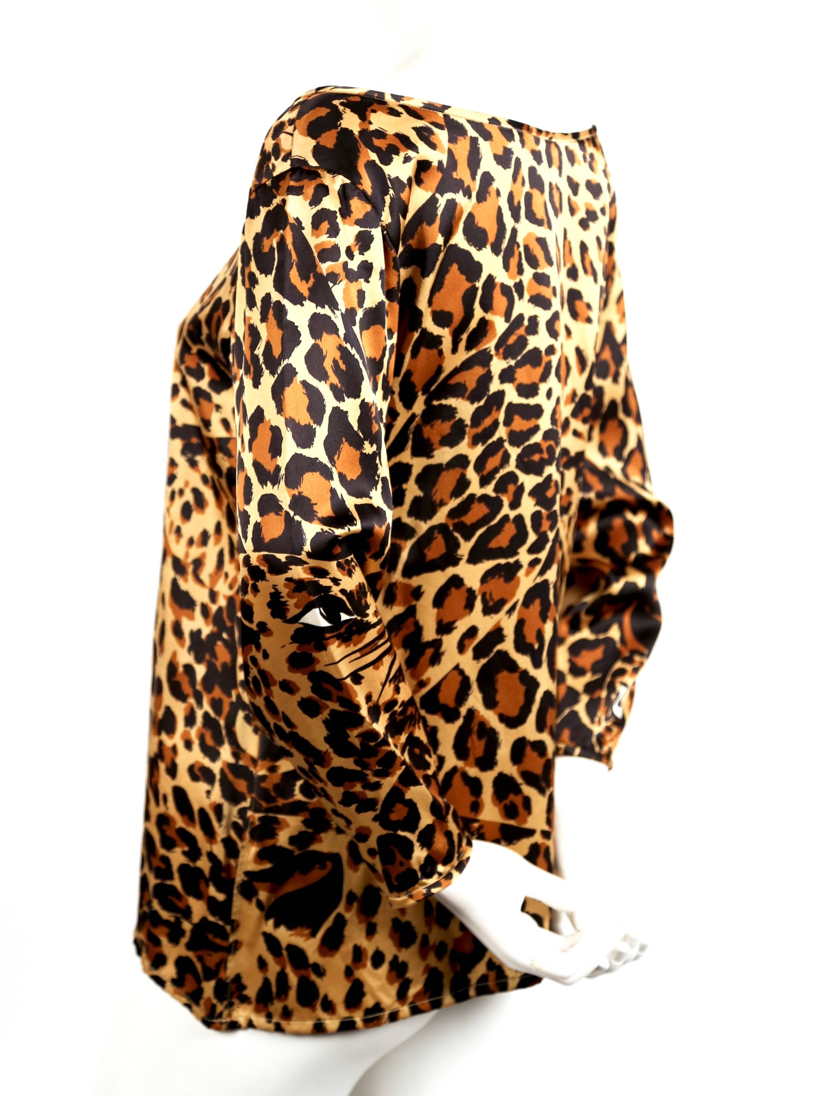 Leopard-printed, silk top with boat neckline from Yves Saint Laurent dating to Fall 1986 as seen on the runway. Labeled a French size 38. Approximate measurements: shoulders 18
