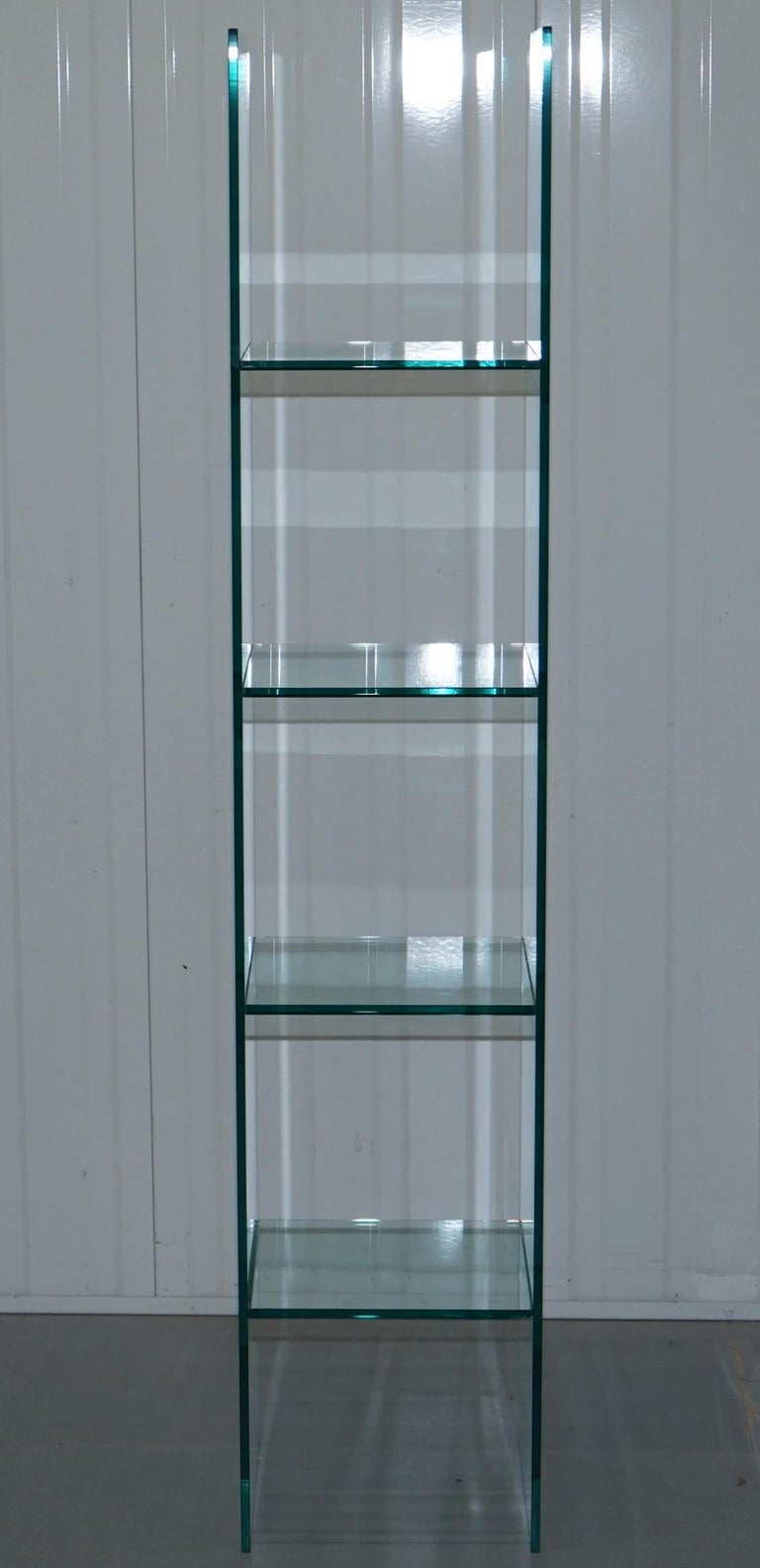 We are delighted to offer for sale this lovely 1987 Babele glass shelf designed by Massimo Morozzi for Fiam Italia.

Babele is a classic tower display unit in 10 mm-thick curved glass with welded and bevelled 10 mm-thick glass shelves. Its