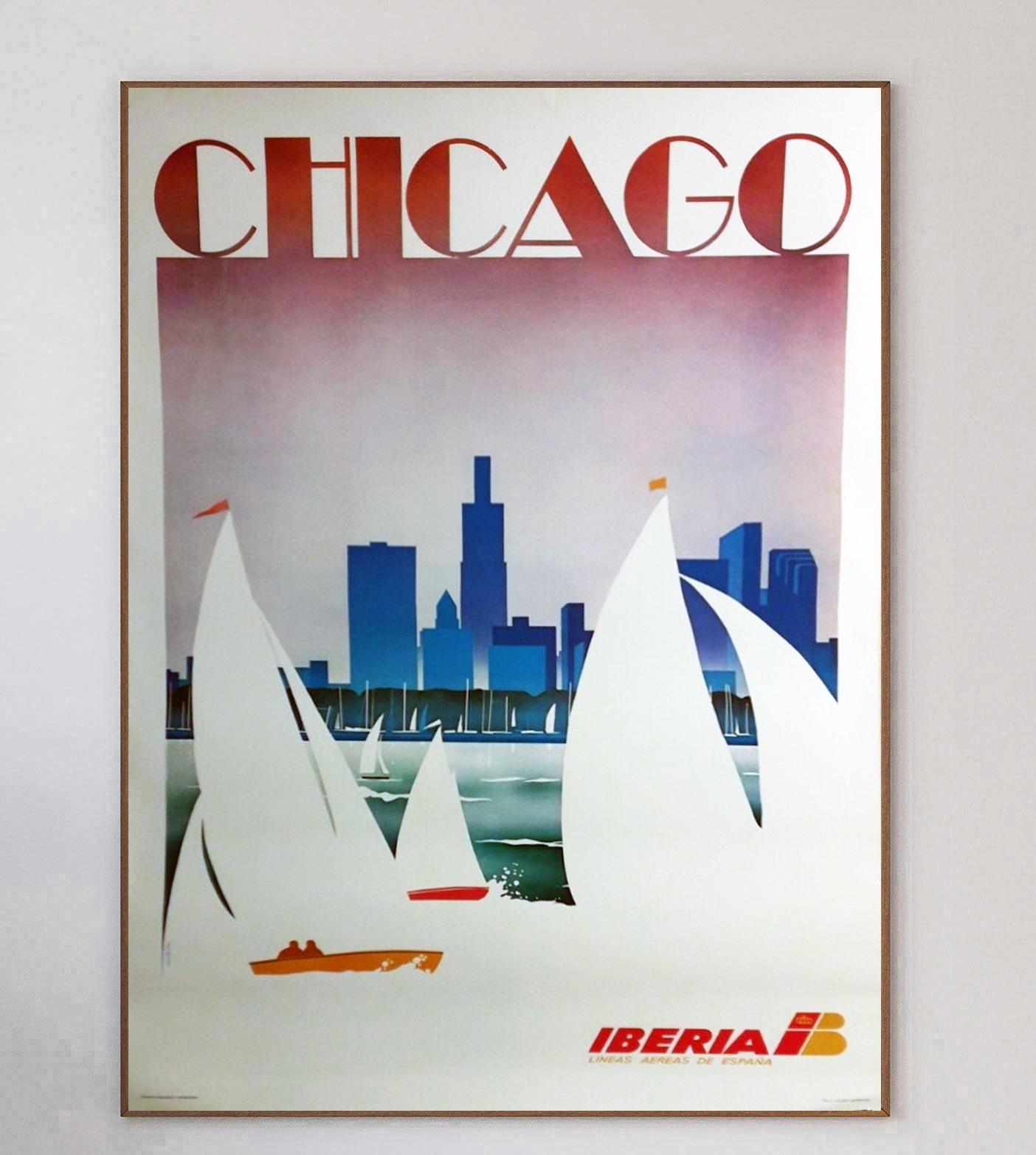 Beautiful poster from 1987 promoting Iberia airlines routes to the US city of Chicago. The Spanish airline was founded in 1927 and continues strong to this day. With brilliant art deco inspired design, the poster depicts sailing boats on Lake
