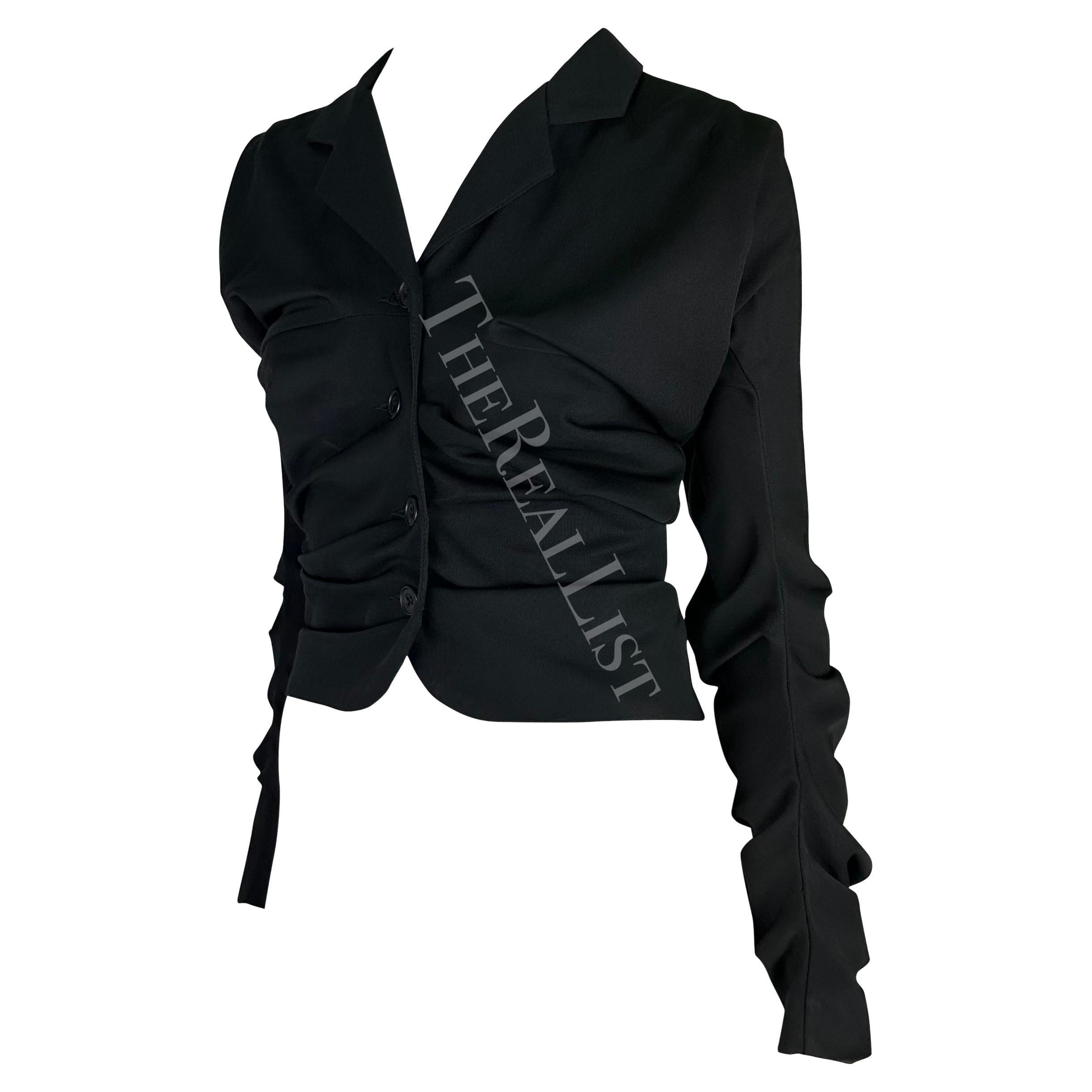 TheRealList presents: a fabulous black ruched John Galliano London jacket. Step into the realm of effortless sophistication with the fabulous black ruched John Galliano London jacket. This lightweight top/jacket, originating from a captivating era,