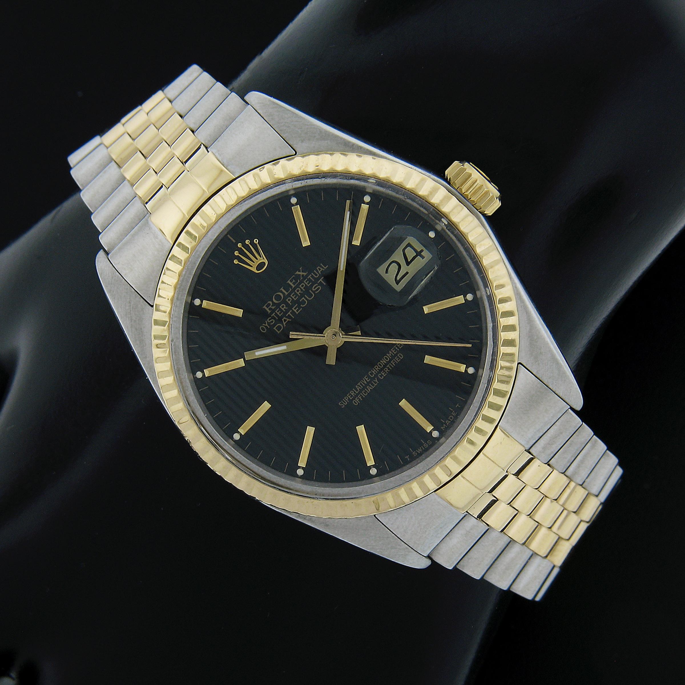 This forever classic unisex Rolex Datejust is from the year 1987 and reference 16013. The automatic self-winding movement runs smoothly and keeps accurate time, and the watch remains in excellent overall physical condition. The black tapestry dial