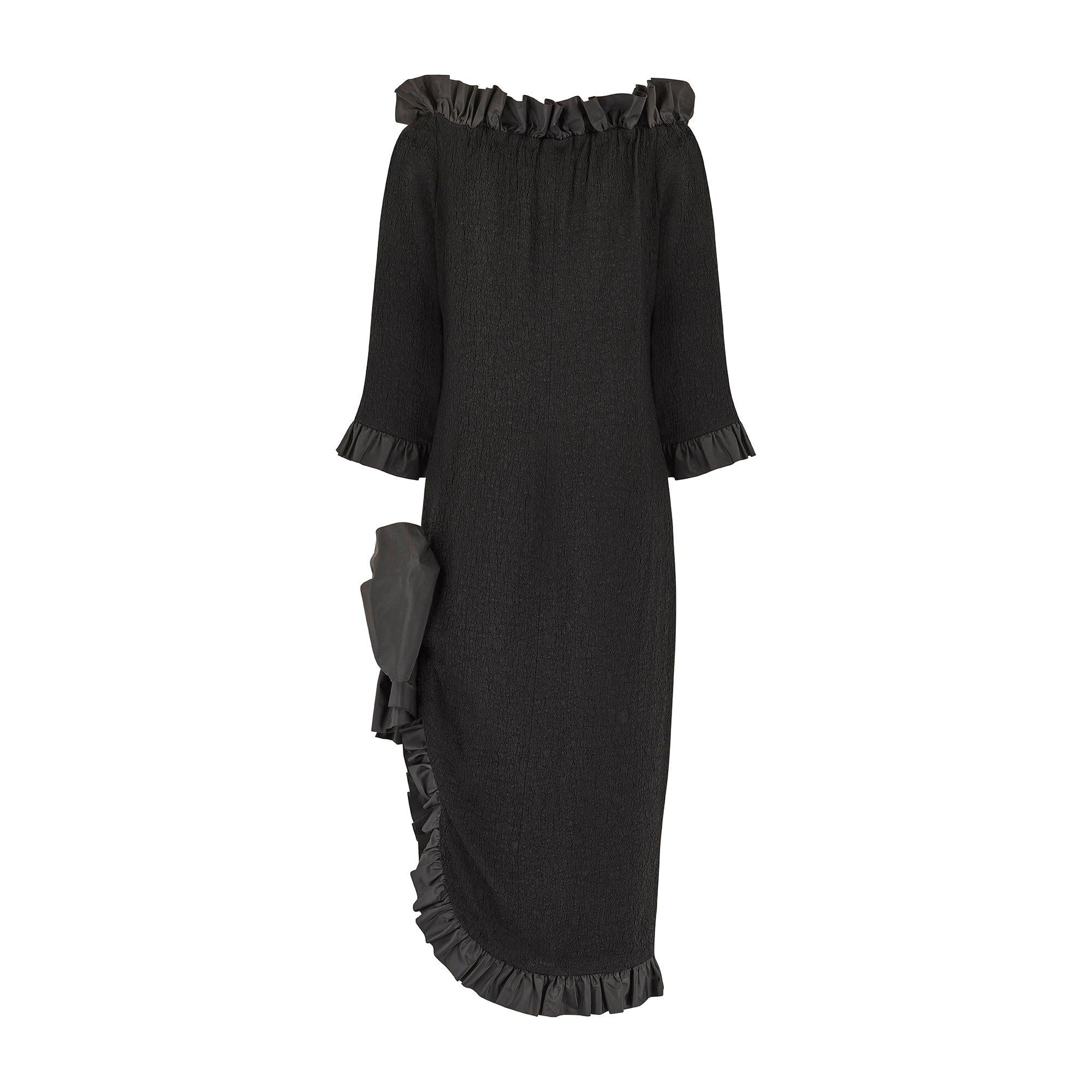 This well documented dress was part of Yves Saint Laurent’s much sought after Spring 1987 collection, when Yves himself was still at the helm of his eponymous fashion house. The fabric is stunning with its innovative, crinkled texture that is
