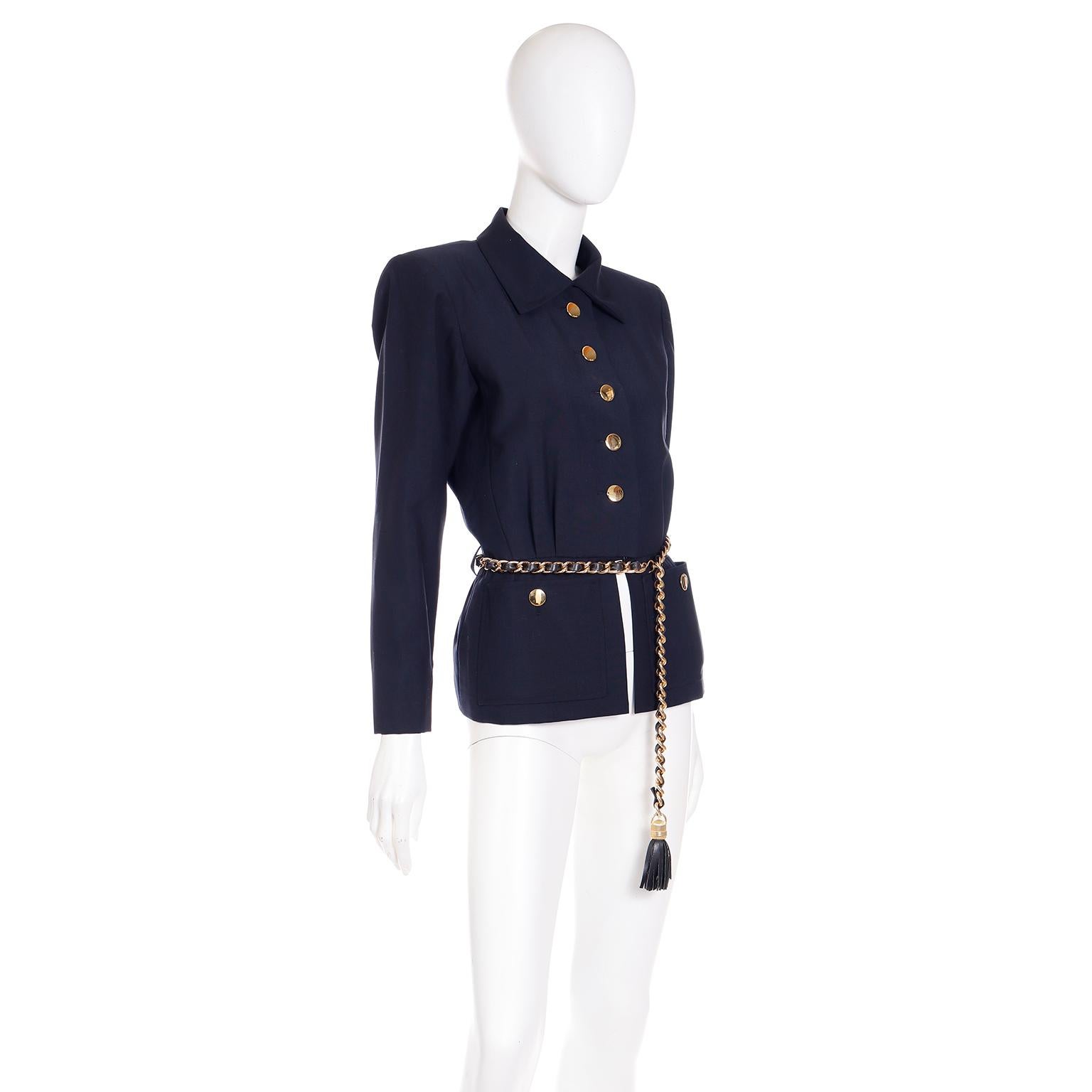 This chic vintage Yves Saint Laurent jacket is in a luxe navy blue wool and mohair blend. This Spring/Summer 1987 YSL jacket has pretty round gold metal button closures down the center front and a pointed collar. We love the split seam below the