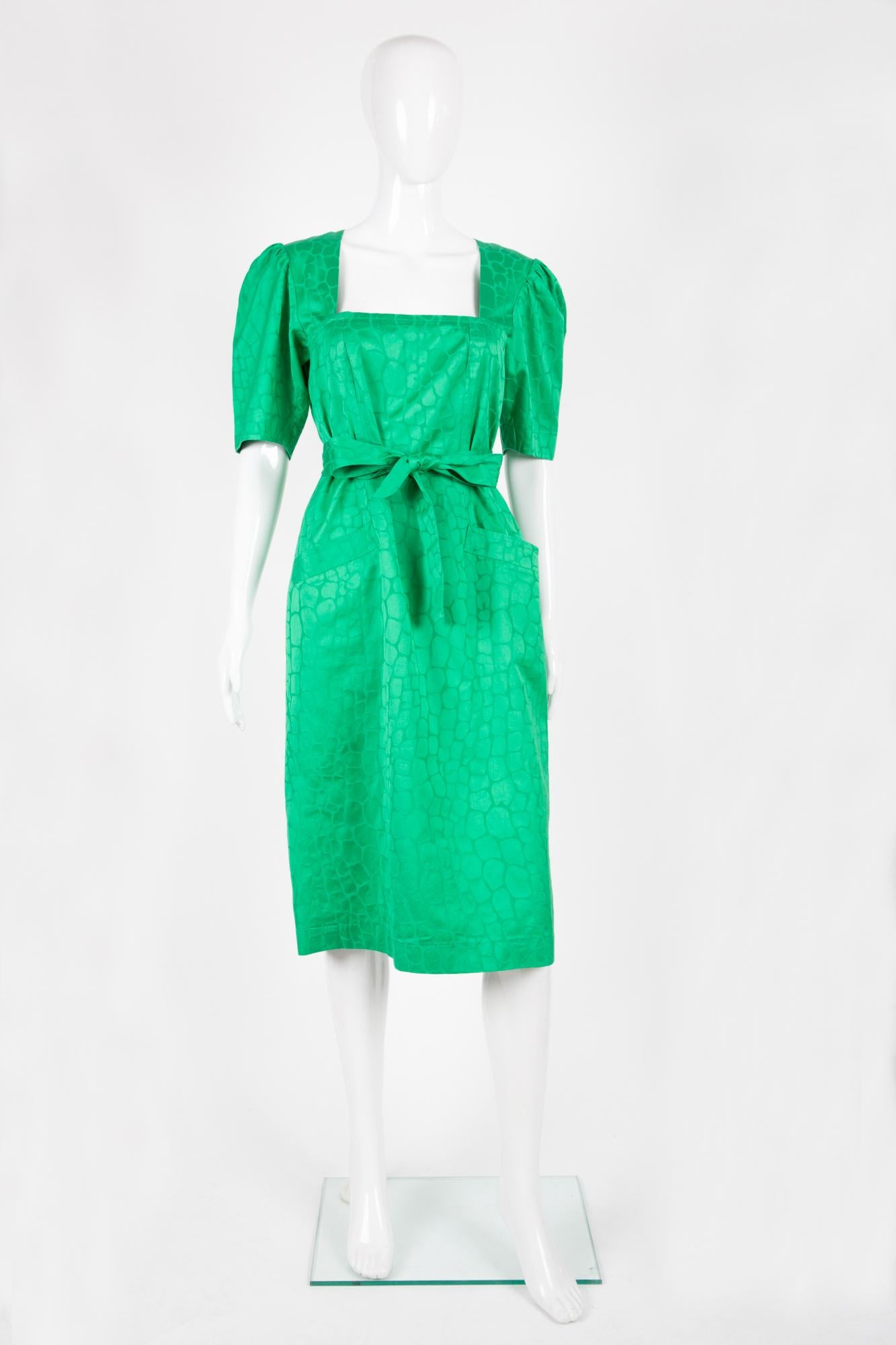 Yves Saint Laurent green dress featuring a jacquard pattern, a separated belt, back button opening, front pockets. 
100% cotton
In excellent vintage condition. Made in France. 
Label size 338fr/US6 /UK10
We guarantee you will receive this gorgeous
