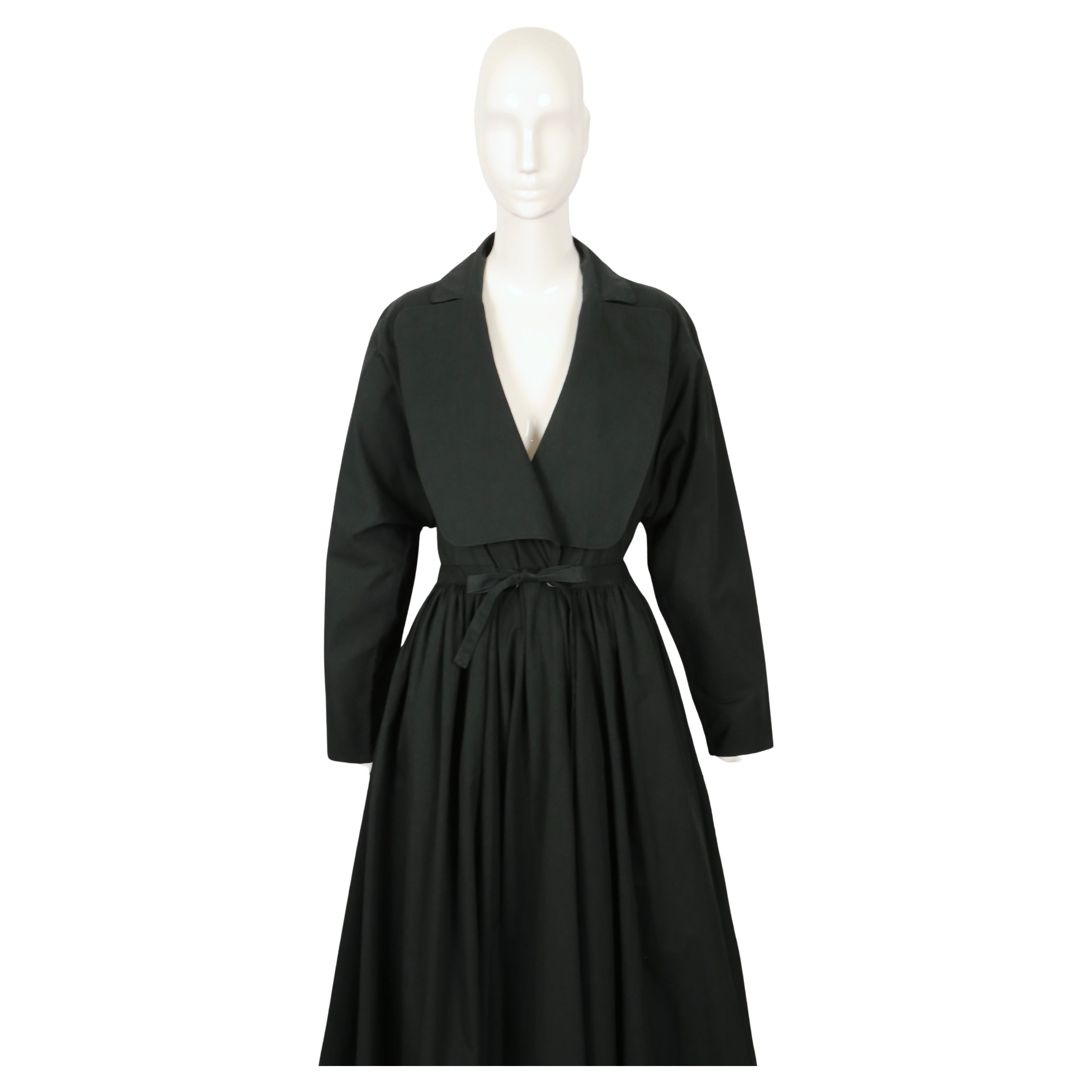 Very rare, black coat with voluminous skirt from Azzedine Alaia dating to spring of 1988 as seen on the runway. Labeled a size 38 however due to the cut, this coat fits a size smaller or larger. Approximate measurements: drop shoulder 19