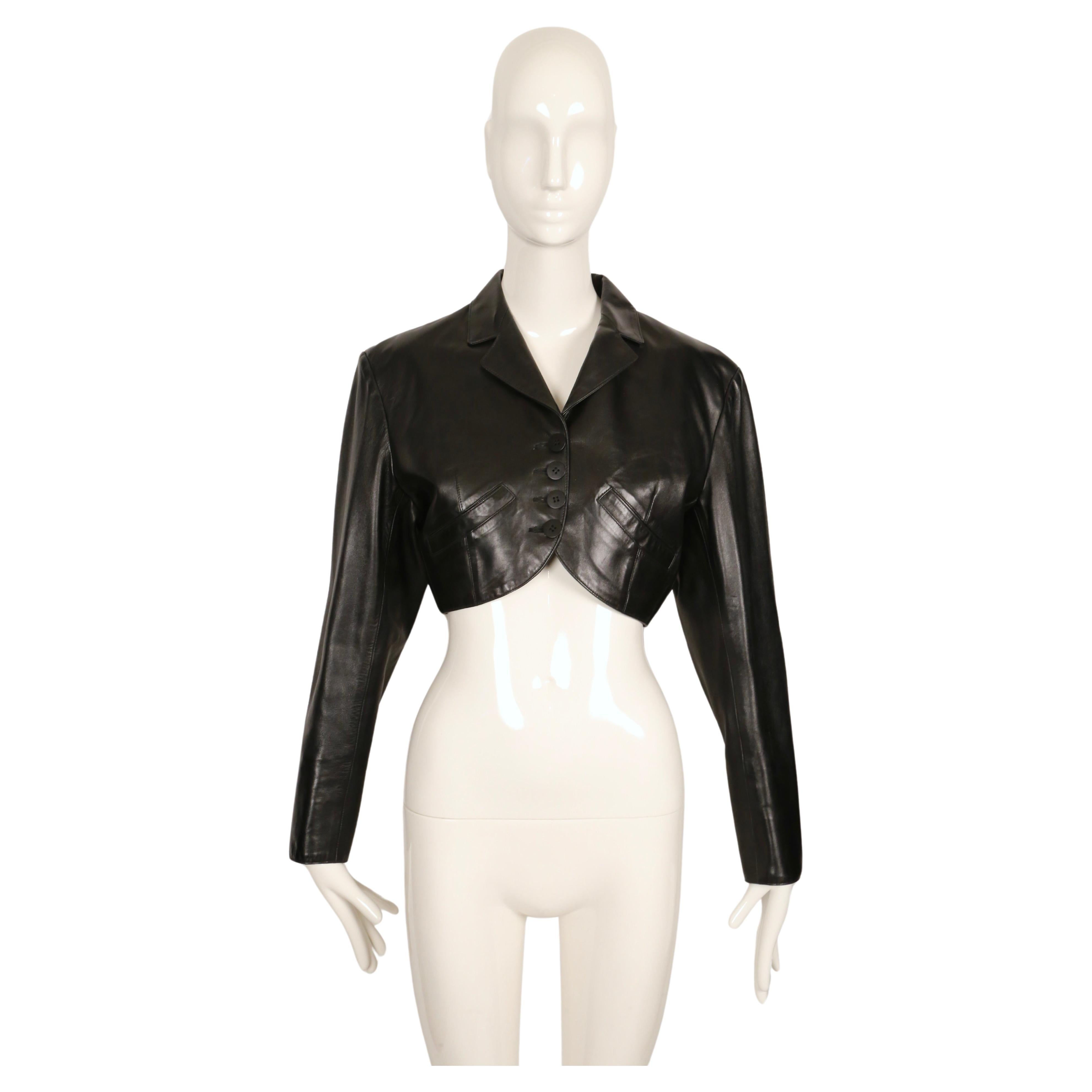 Cropped, jet-black, butter-soft leather jacket with notched collar and curved pockets designed by Azzedine Alaia dating to 1988. Jacket has a very flattering silhouette.  Labeled a French size 38. Approximate measurements: shoulder 17