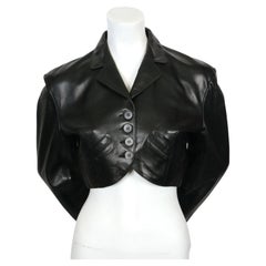 1988 AZZEDINE ALAIA cropped black leather jacket with curved pockets
