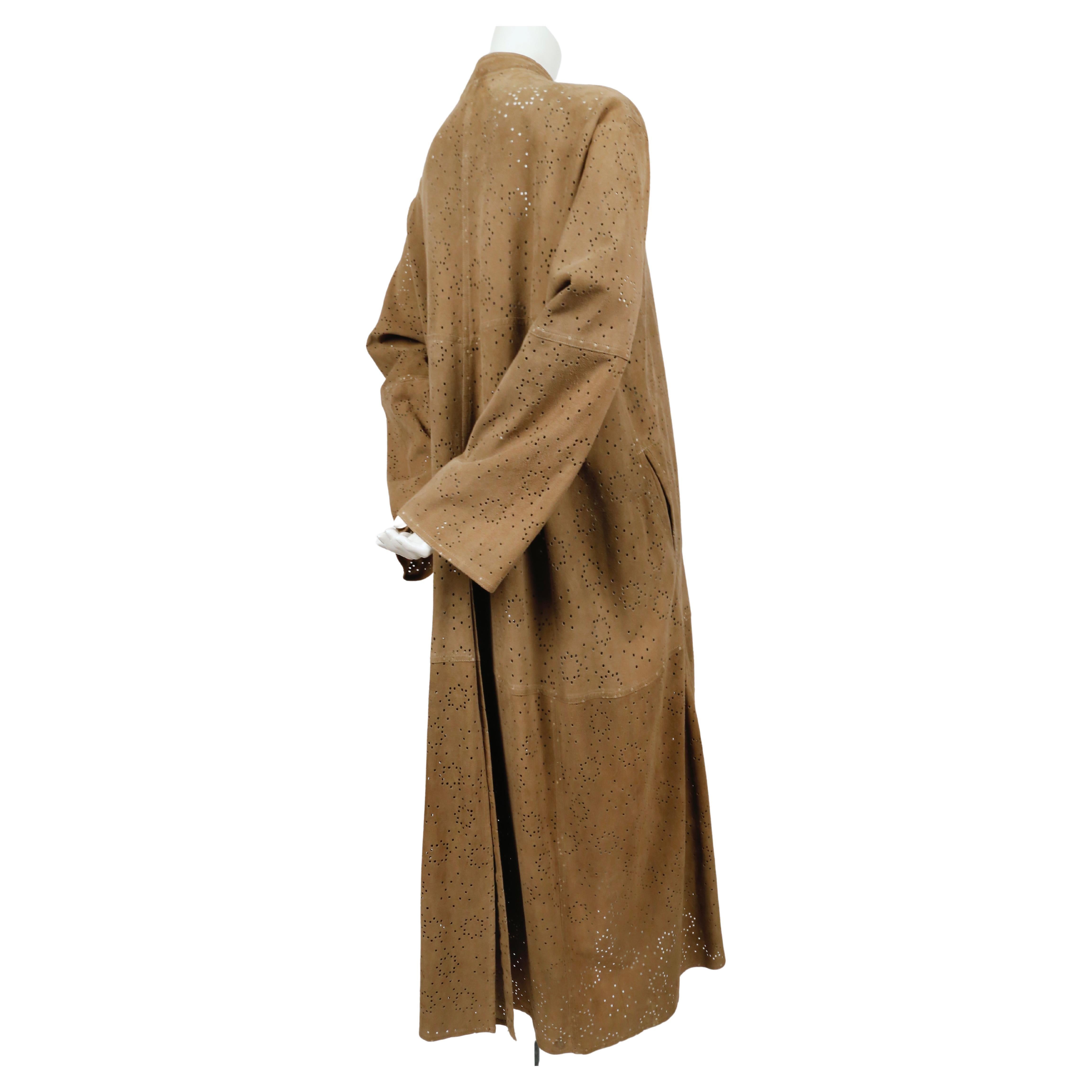 Very rare, tan suede, laser-cut coat from Azzedine Alaia dating to spring of 1988. Labeled a size 36 however due to the oversized cut, this coat fits many sizes. Approximate measurements: drop shoulder 19