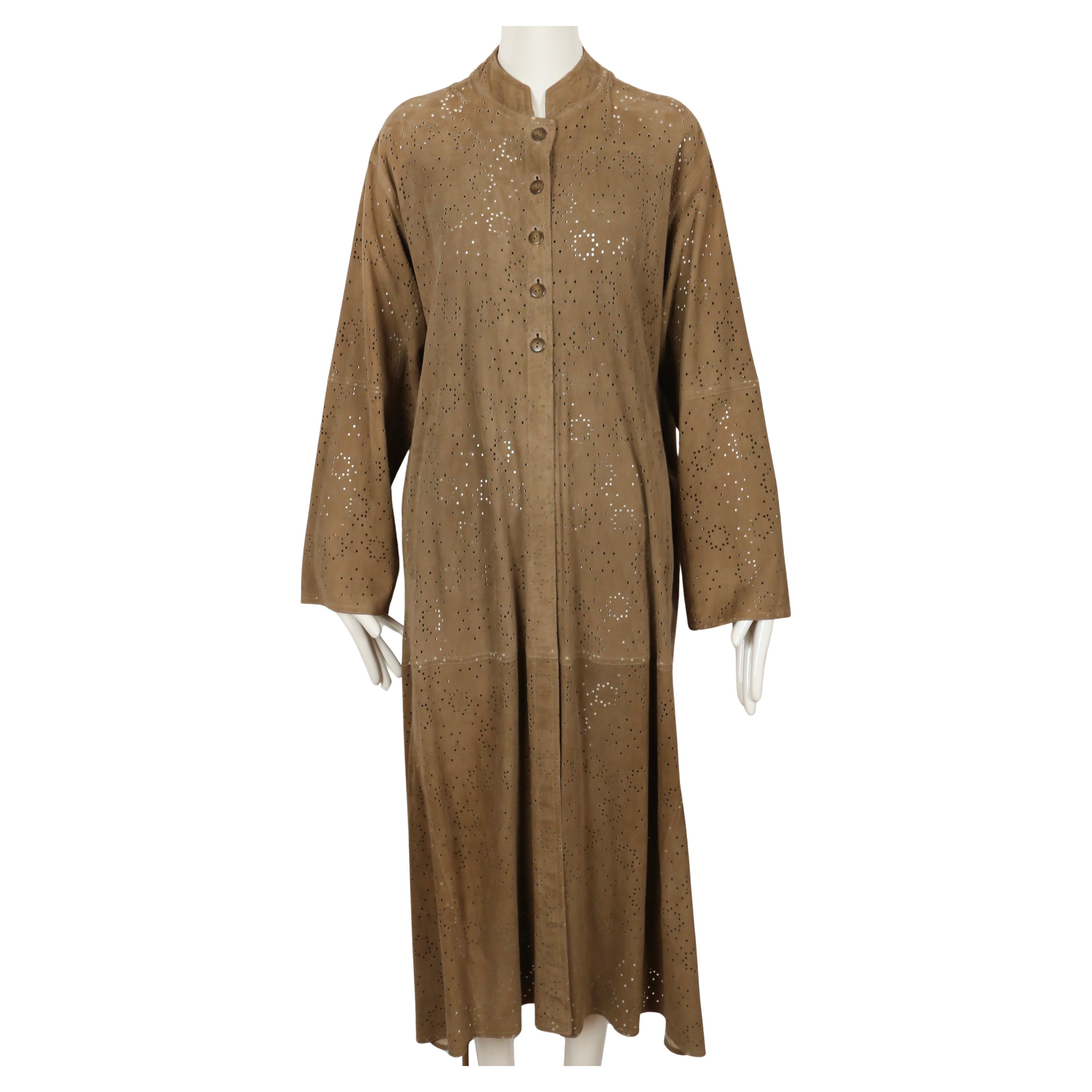 Very rare, tan suede, laser-cut coat from Azzedine Alaia dating to spring of 1989 exactly as seen on the runway. Labeled a size 36 however due to the oversized cut, this coat fits many sizes. Approximate measurements: drop shoulder 19