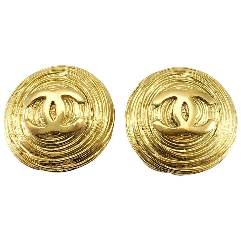 1988 Chanel Large Gold-Plated Textured Round Logo Earrings For Sale