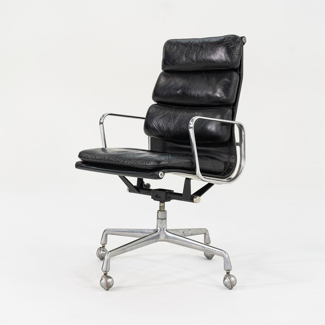 This is an Eames Aluminum Group Soft Pad Executive Chair, Model EA420, designed by Charles and Ray Eames for Herman Miller in 1968. This example dates to 1988. The design features a cast aluminum frame with an adjustable four-star base, and has
