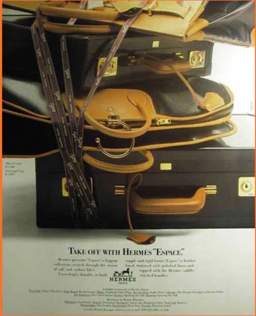 1988 Hermes black “Espace” briefcase Limited Edition featuring a carbon fiber front, leather handle, gilt metal hardware, natural leather inside, push-lock fastening, internal slip pocket.
Attached image in Elle 1999 by Ellen von Unwerth
Numbered