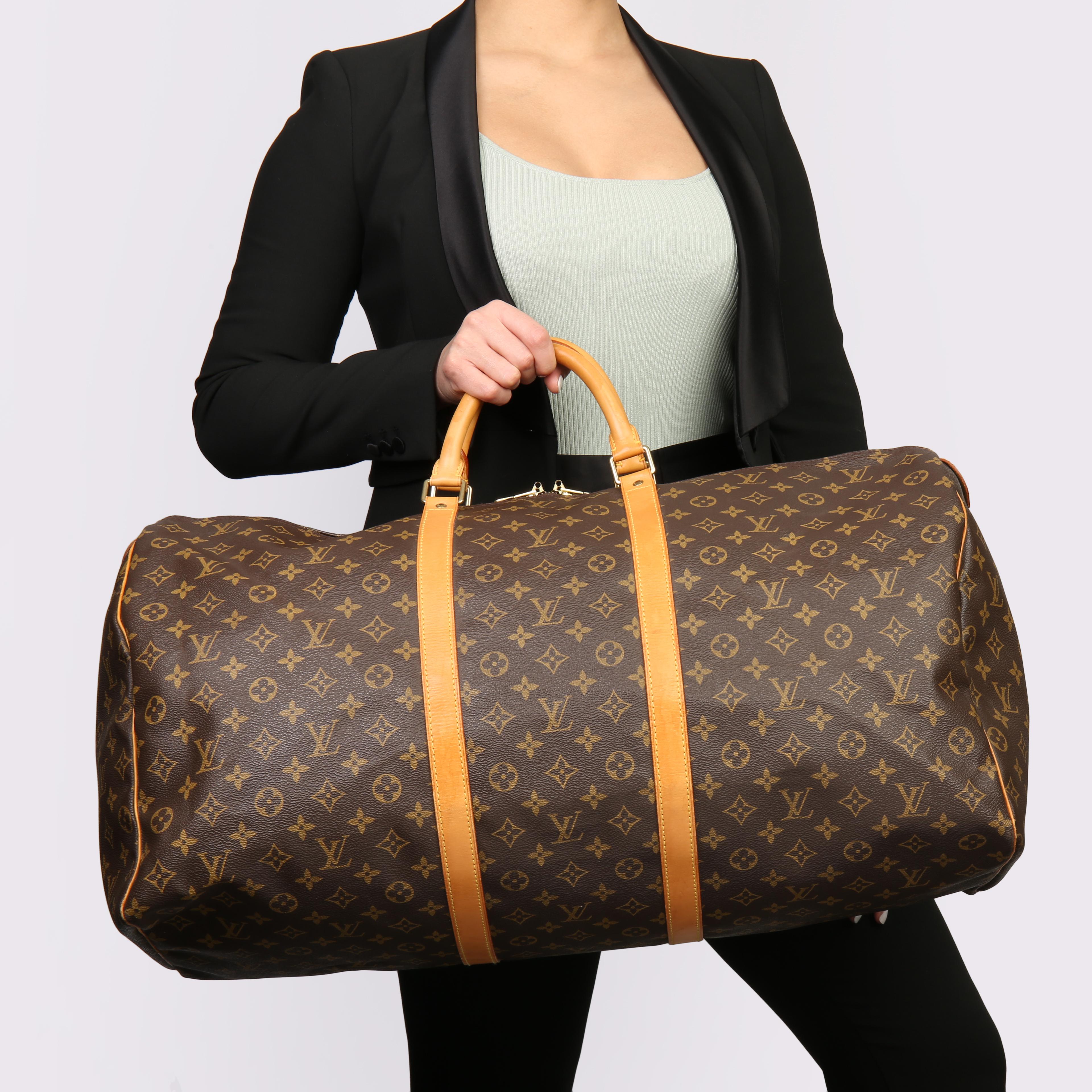 LOUIS VUITTON
Brown Monogram Coated Canvas & Vachetta Leather Vintage Keepall 55

Xupes Reference: HB3705
Serial Number: MI 882
Age (Circa): 1988
Accompanied By: Luggage Tag, Handle Keeper
Authenticity Details: Date Stamp (Made in France) 
Gender: