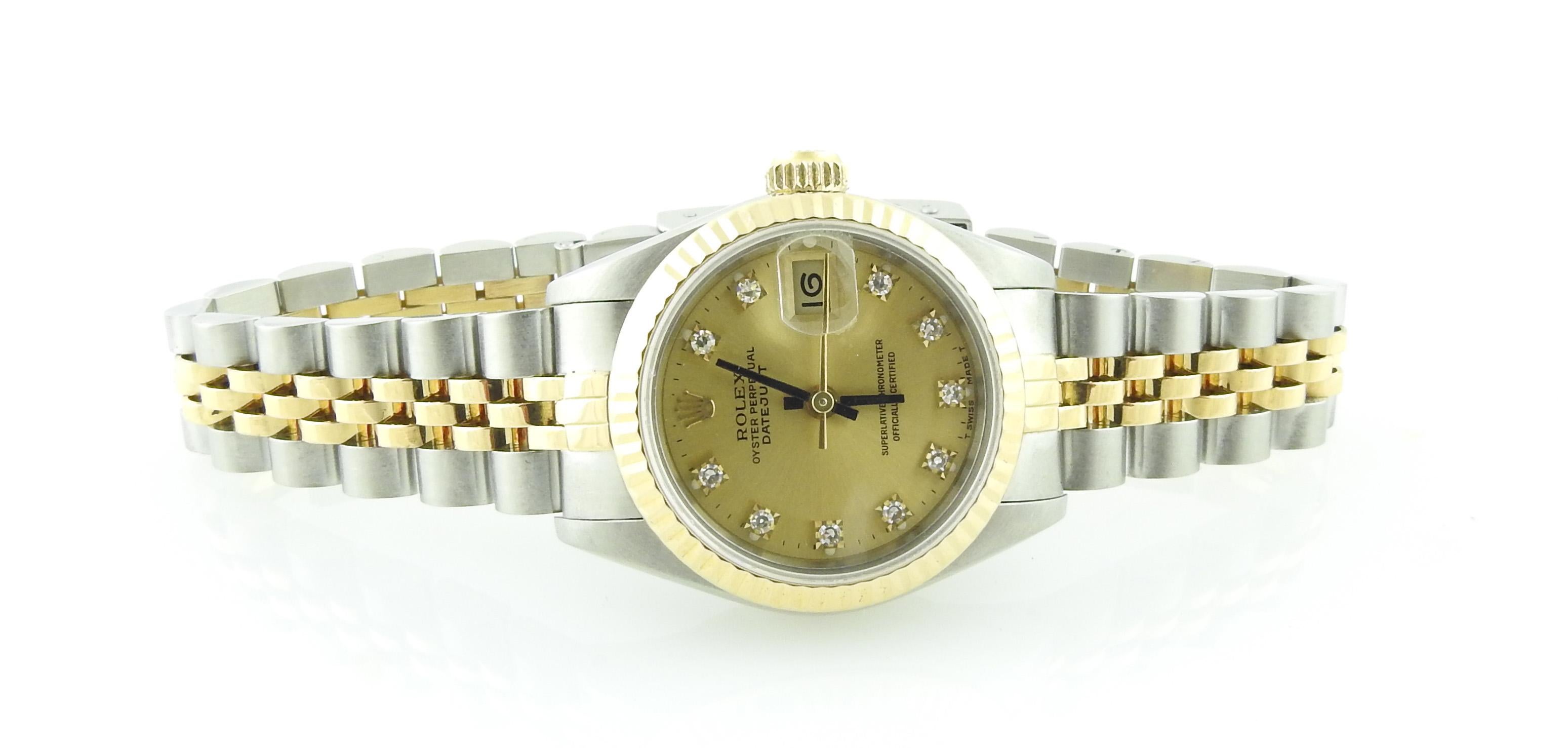 1988 Rolex Ladies Two Tone Watch

Model: 69173
Serial: R226206

26mm case

Champagne dial with 10 diamond markers

Gold and stainless jubilee band. Some slight stretch as shown in pictures. Fits up to 6 3/4