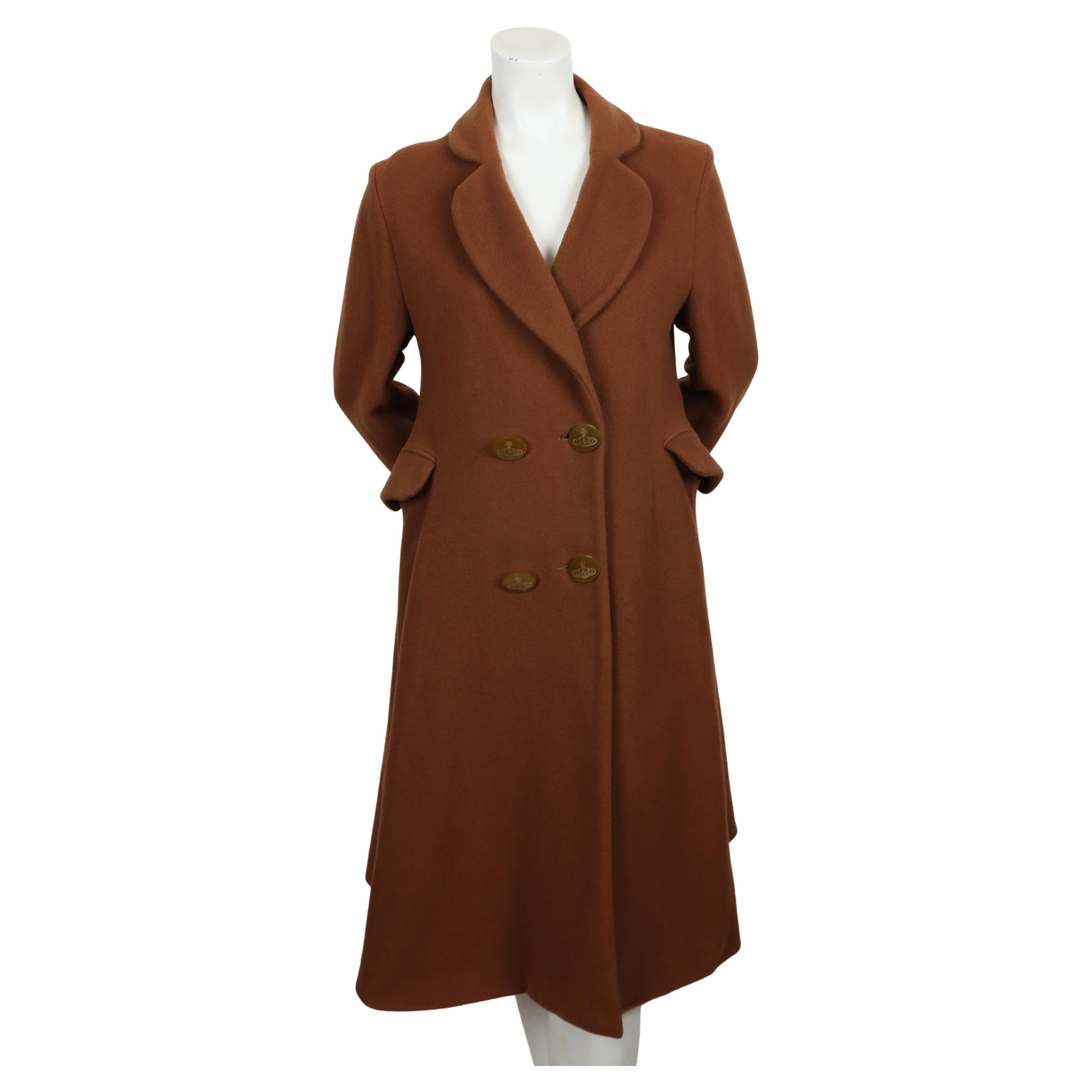 Very rare, cinnabar brown wool coat with signature orb buttons and heart shaped lapels designed by Vivienne Westwood dating to fall of 1988 as seen on the 'Time Machine' runway.  Coat has a really great silhouette.  Coat is labeled a UK size '12',