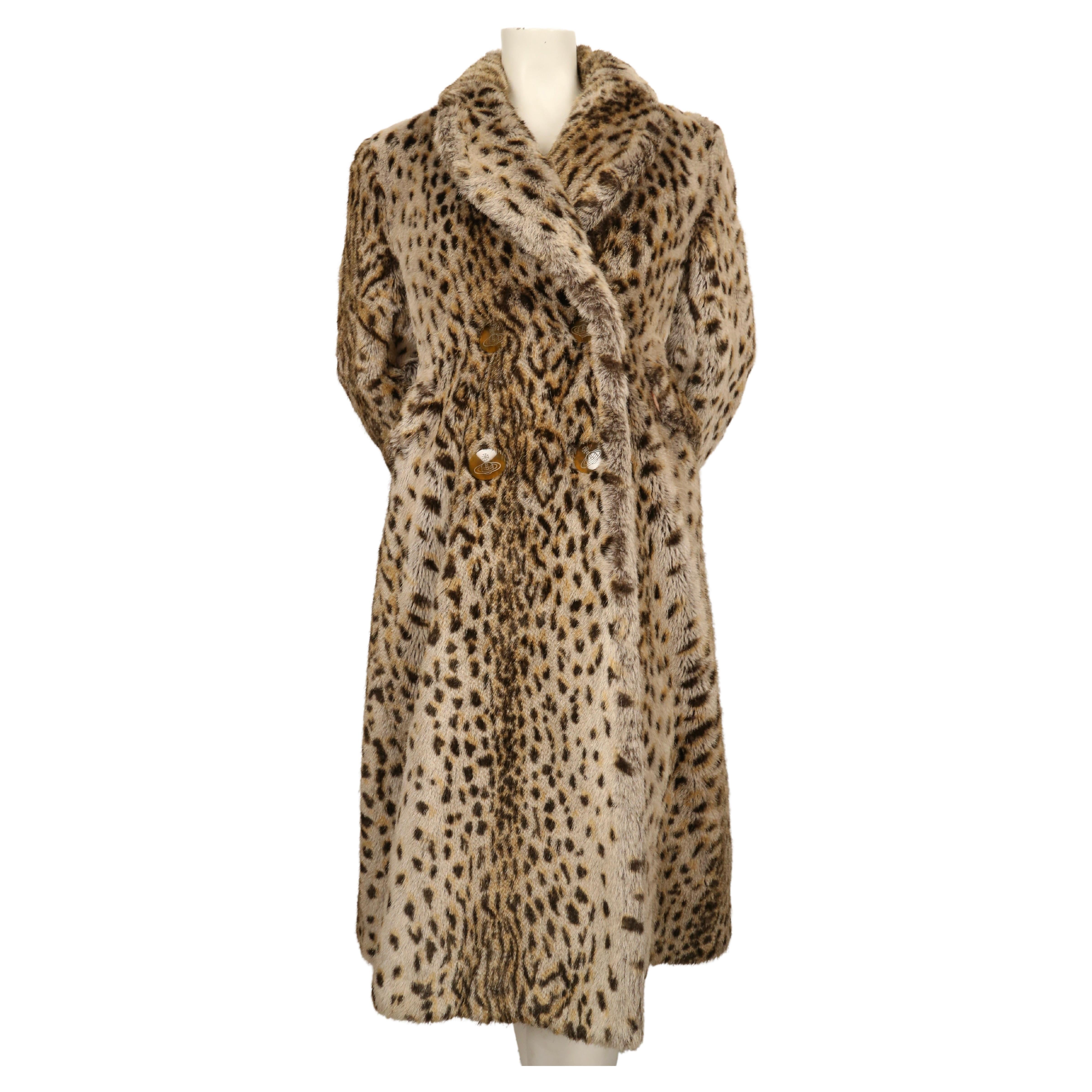 Very rare, faux fur leopard coat with signature orb buttons designed by Vivienne Westwood dating to fall of 1988 as seen on the 'Time Machine' runway.  Coat has a really great silhouette and is very heavy for cold weather.  Coat is labeled a UK size