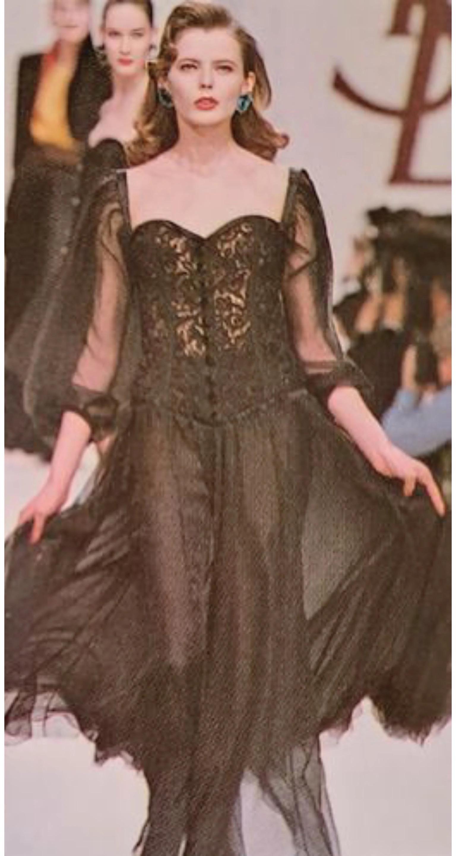 A highly coveted and super seductive Yves Saint Laurent rive gauche black sheer silk dress with built-in boned lace bustier dating back to his iconic, well-documented 1988 fall-winter collection. It has such an insanely chic vibe with its fluid yet