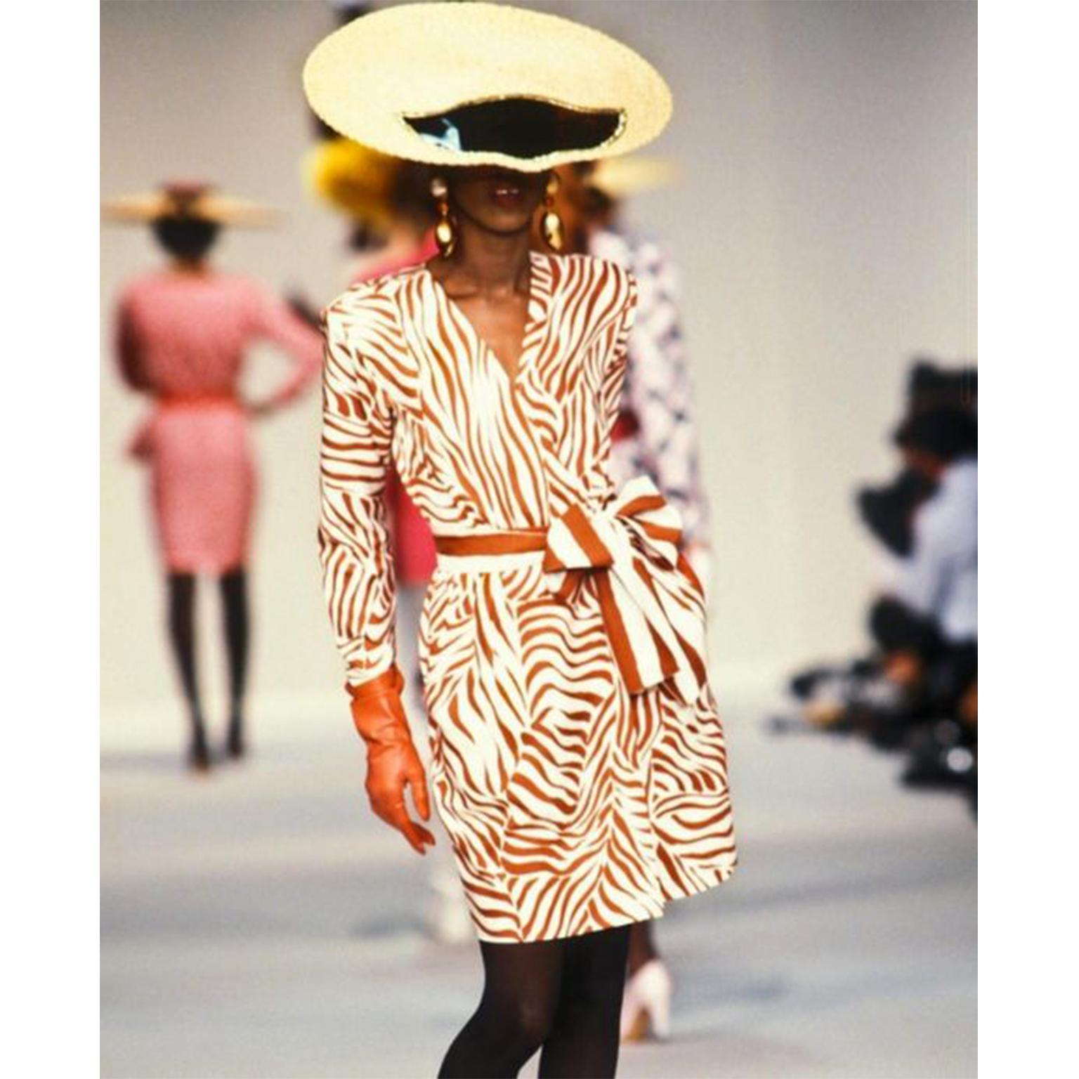 This is a vintage 1988 Yves Saint Laurent Rive Gauche rusty or burnt orange and cream silk stripe dress with structured shoulder pads. Our photos show the dress as more red, but it is a deep rust orange. This is a another of the iconic YSL 1980's