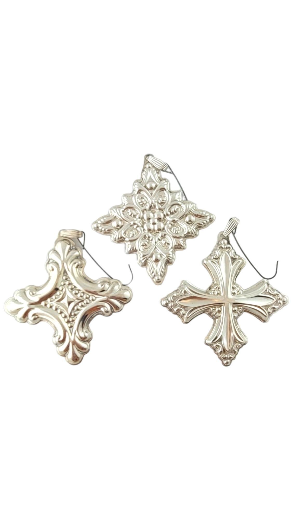 1981-1991 Reed & Barton Christmas Cross Sterling Silver Ornaments

This set of 3 gorgeous Christmas Cross ornaments were crafted with meticulous detail by amazing designer Reed & Barton!
Ornaments dated from 1989-1991.

Ornament 1: 2.62