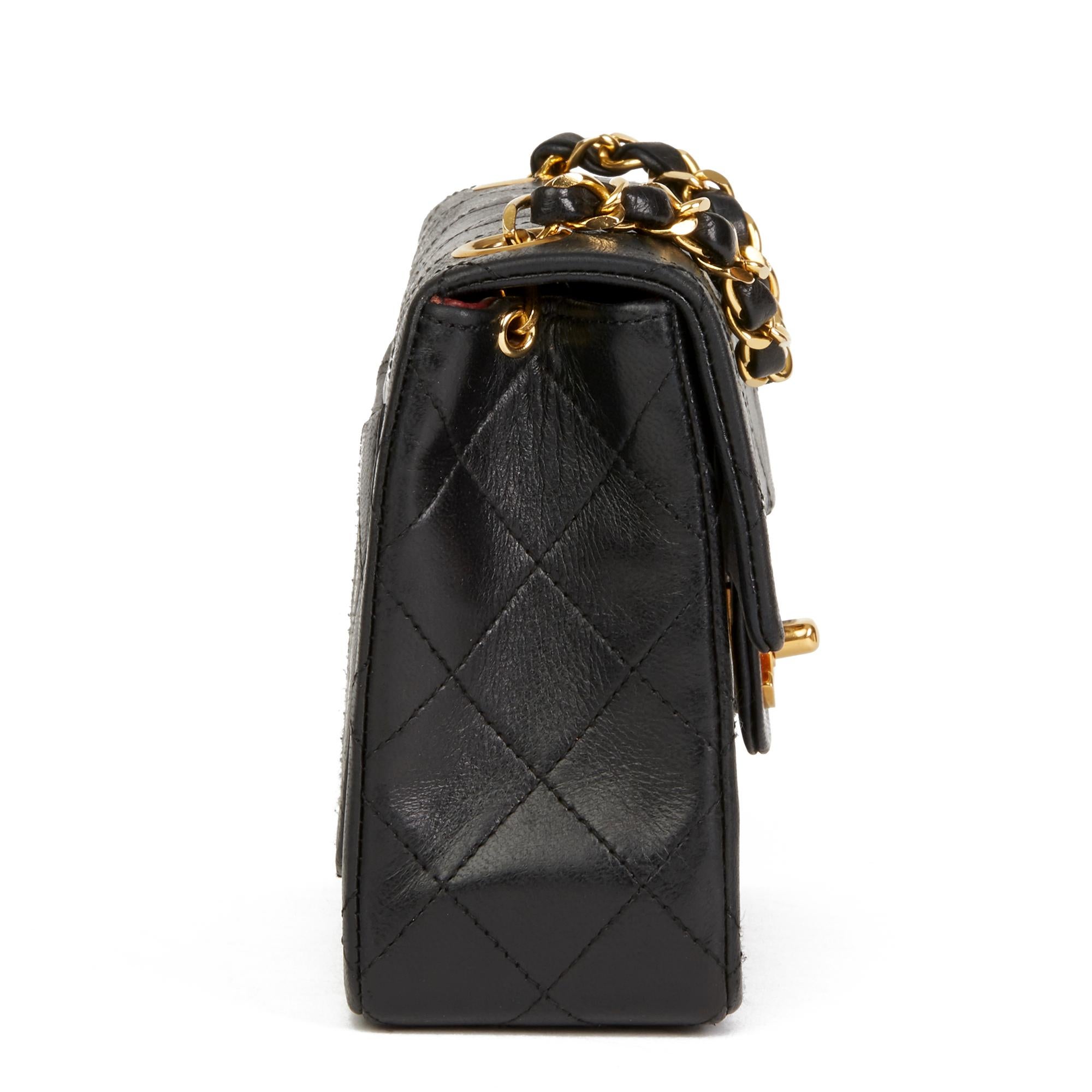 CHANEL
Black Quilted Lambskin Vintage Mini Flap Bag

Reference: HB2599
Serial Number: 0787572
Age (Circa): 1989
Accompanied By: Chanel Dust Bag, Box
Authenticity Details: Serial Sticker (Made in France)
Gender: Ladies
Type: Crossbody,