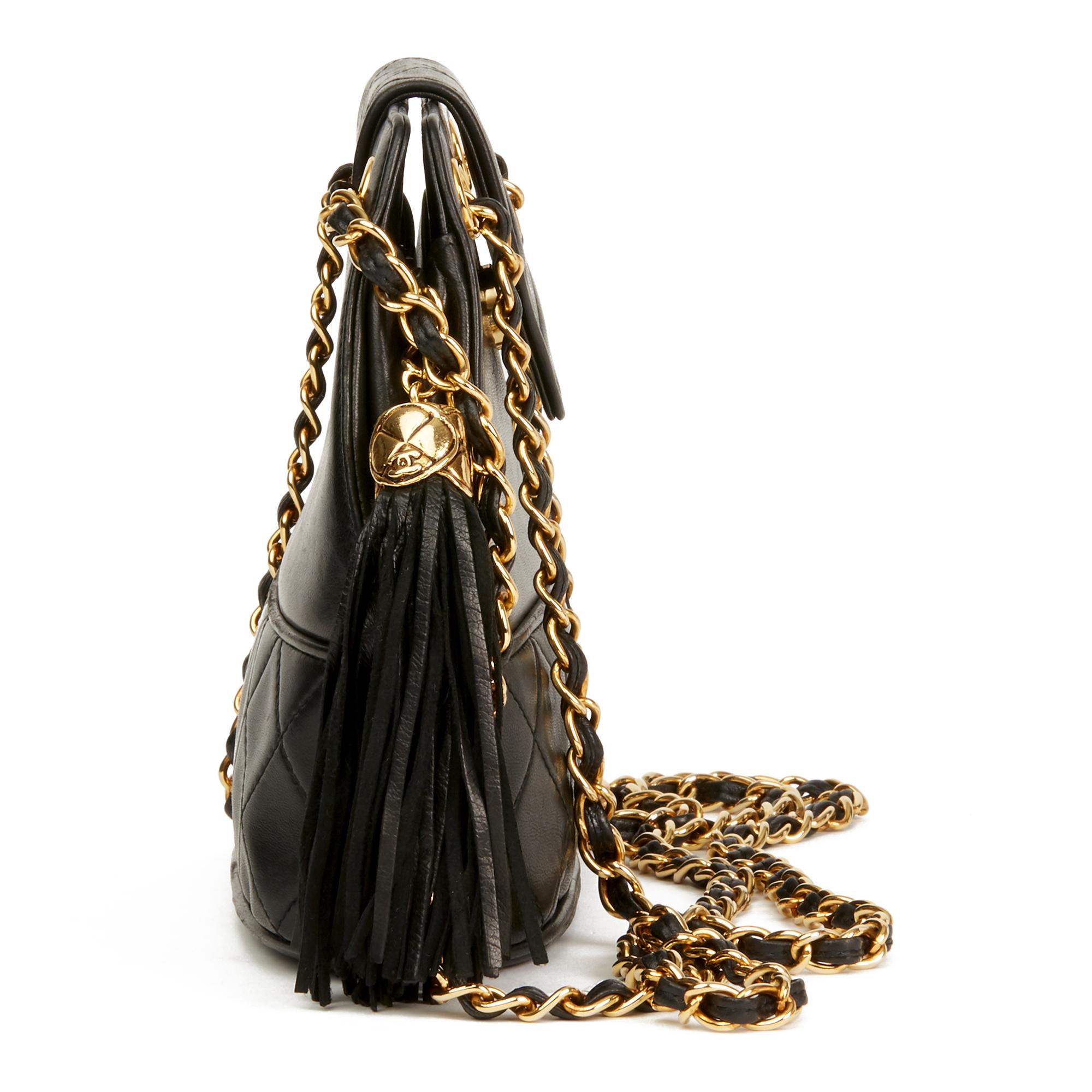 CHANEL
Black Quilted Lambskin Vintage Timeless Fringe Bucket Bag

Reference: HB2859
Serial Number: 1301919
Age (Circa): 1989
Authenticity Details: Serial Sticker (Made in Italy)
Gender: Ladies
Type: Shoulder

Colour: Black
Hardware: