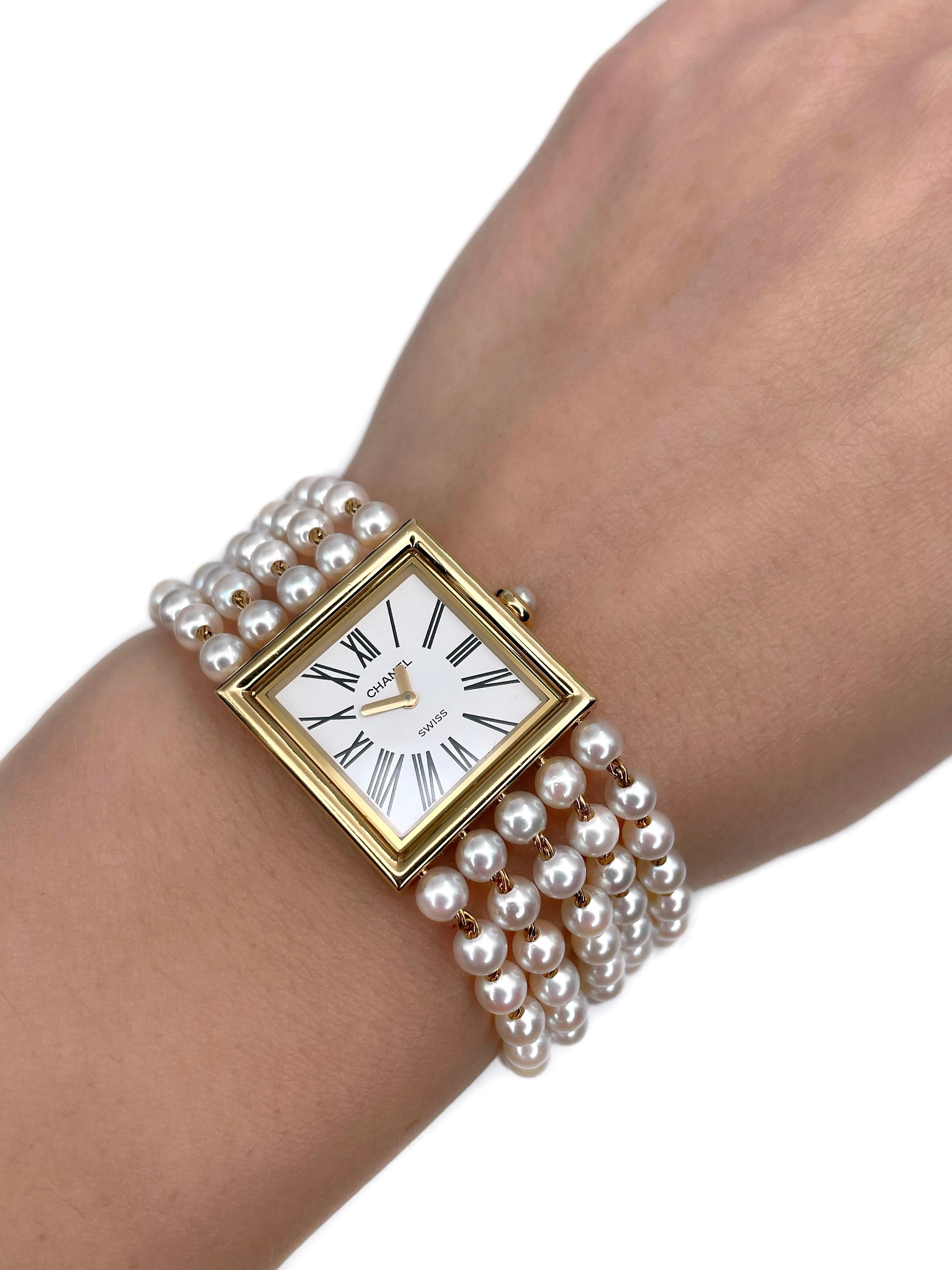 This is a luxurious vintage wrist watch designed by Chanel in 1989. The piece is crafted in 18K yellow gold and features cultured pearls. It is an elegant accessory. 

Model: Mademoiselle
Reference no.: M.E. 11918
Year: 1989
Movement: Quartz, Swiss