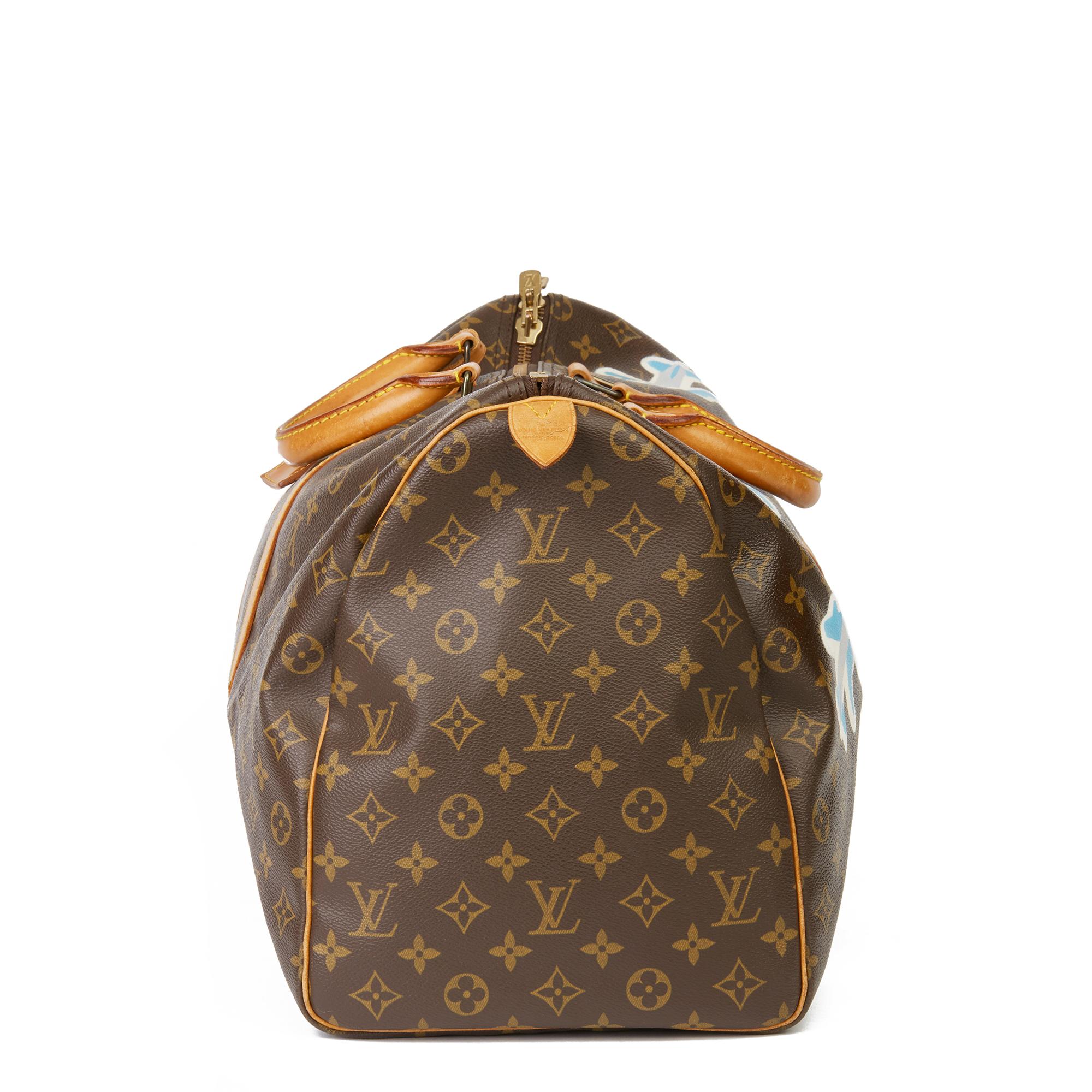 LOUIS VUITTON
X Year Zero London Hand-painted  ‘Paper Plane$’ Brown Monogram Coated Canvas Keepall 50

Xupes Reference: HB3242
Serial Number: VI 879
Age (Circa): 1989
Accompanied By: Luggage Tag
Authenticity Details: Date Stamp (Made in