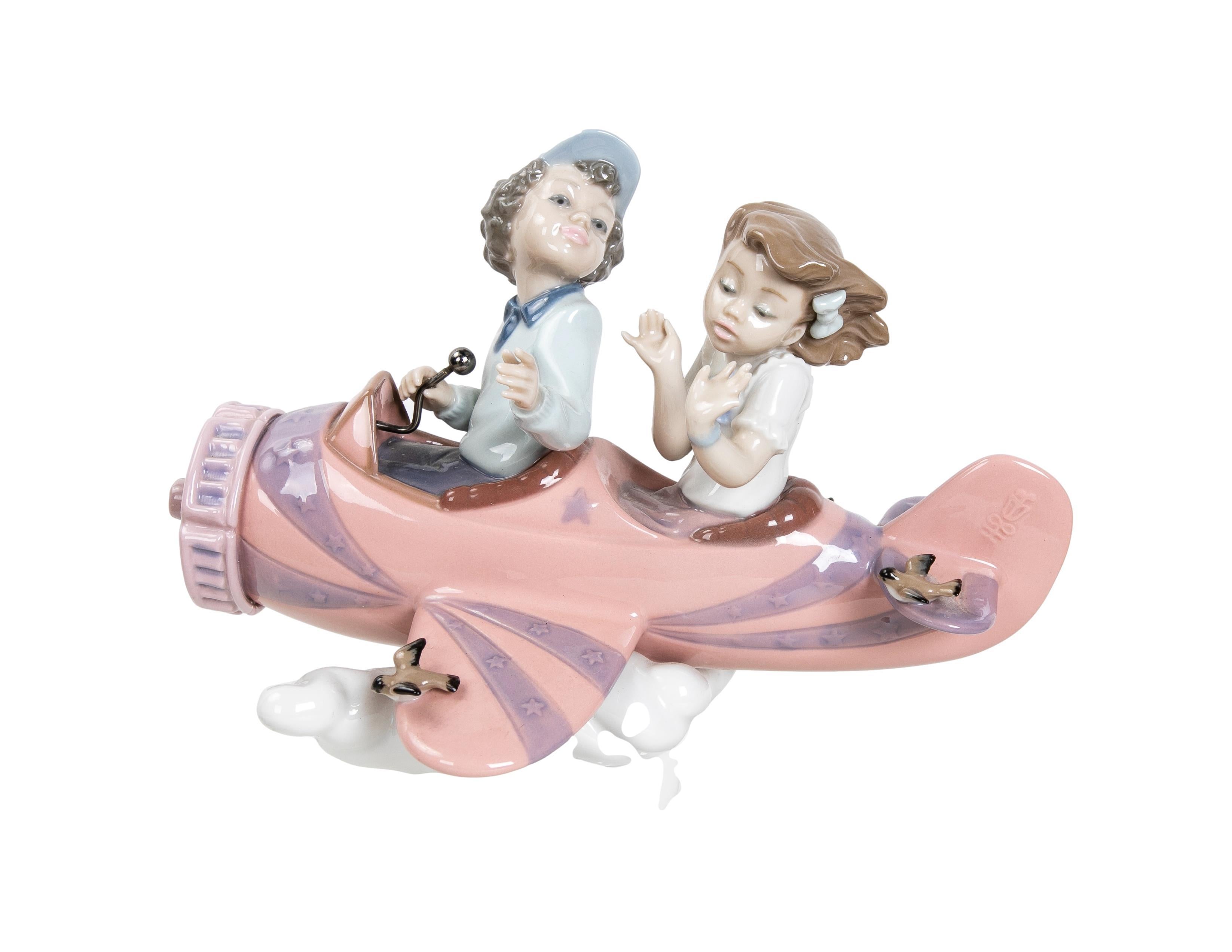 1989 Porcelain figure of children in Airplane signed by the house of LLadró.